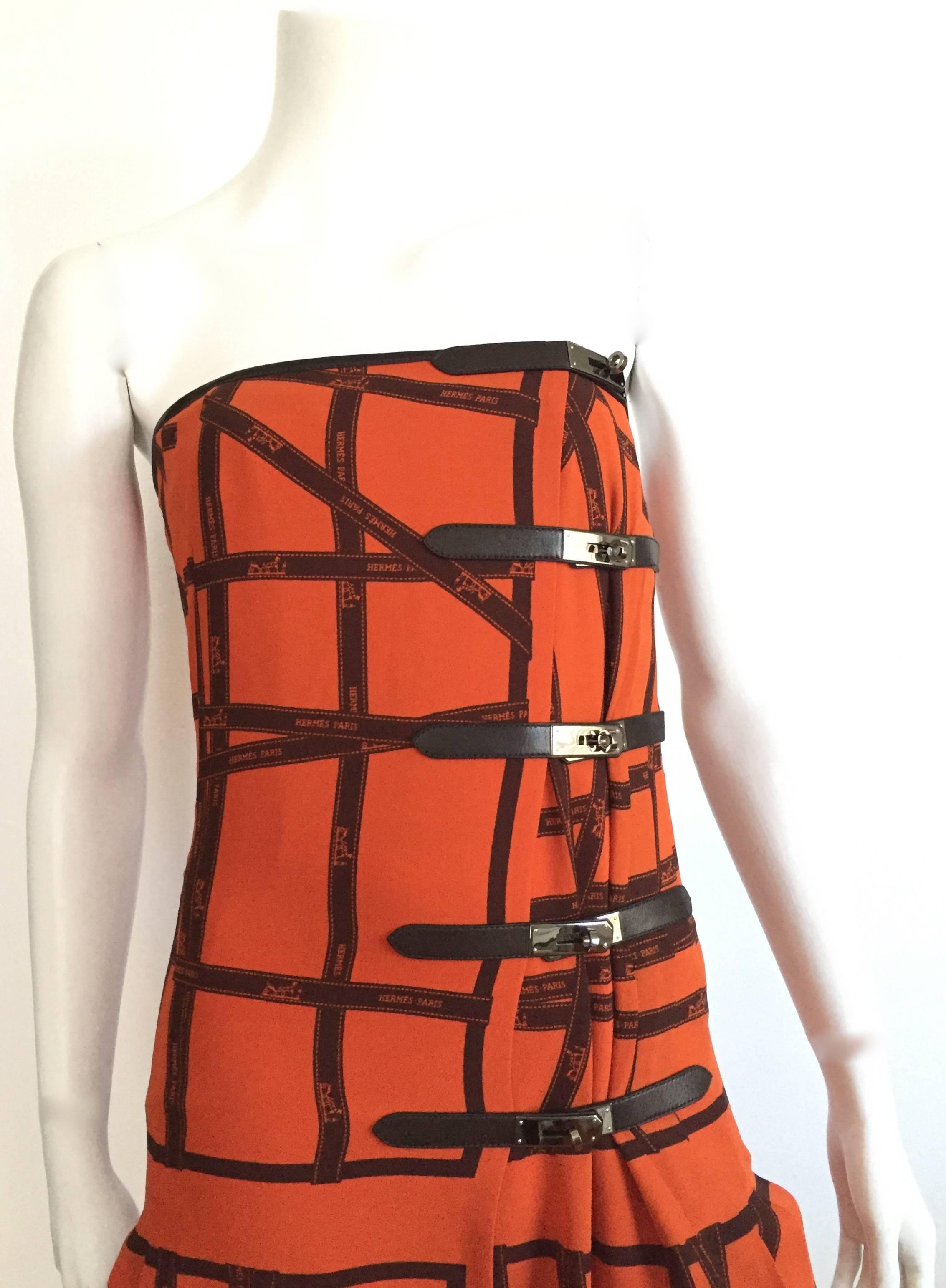 Hermes by Jean Paul Gaultier 2004 orange silk crepe Georgette Bolduc dress is a French size 38 but fits a USA size 4. Please see & use the measurements below so that you may properly measure your lovely body. The mannequin is a size 4 and this dress