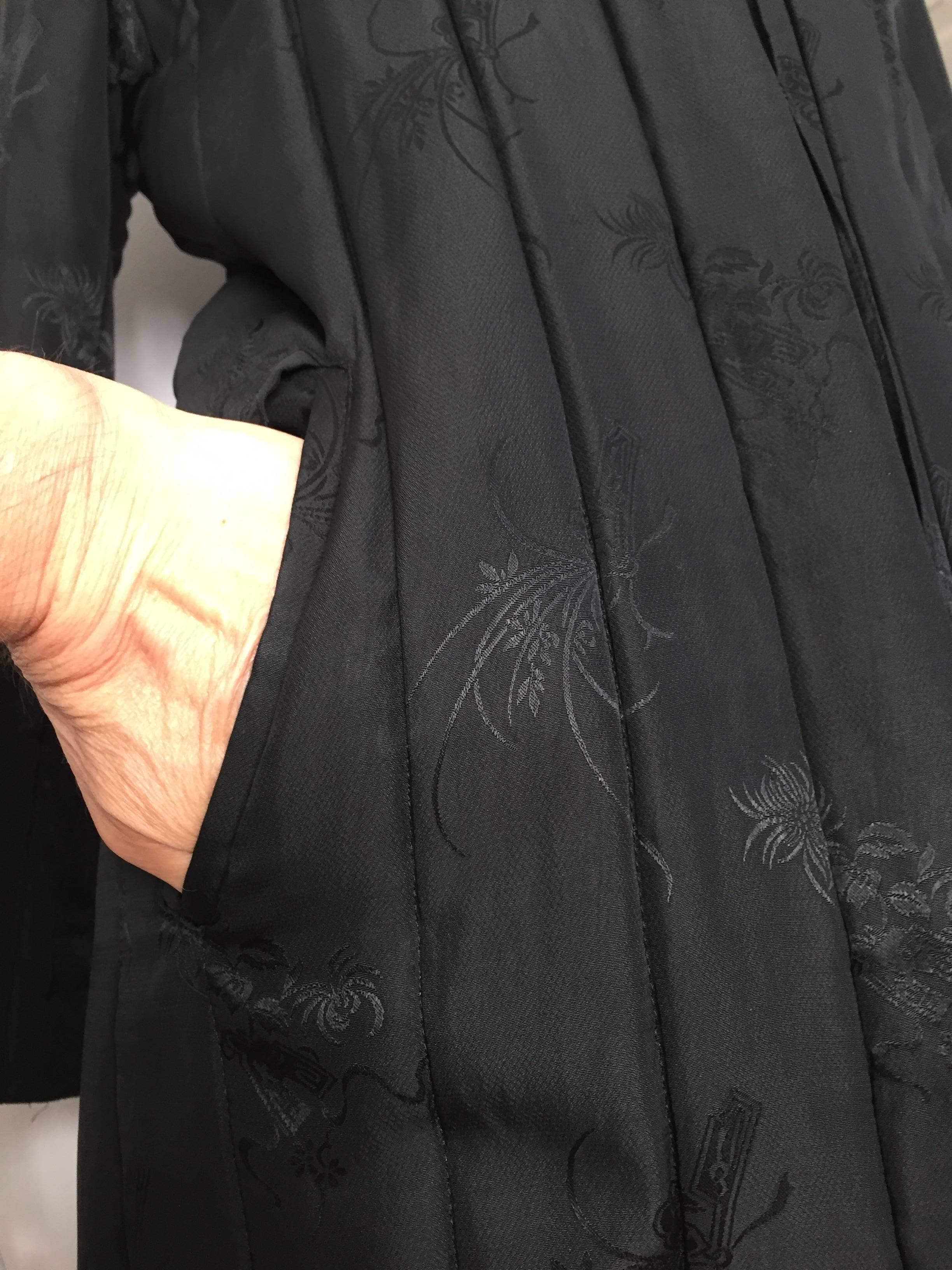 Black Bergdorf Goodman long black silk quilted coat, 1980s