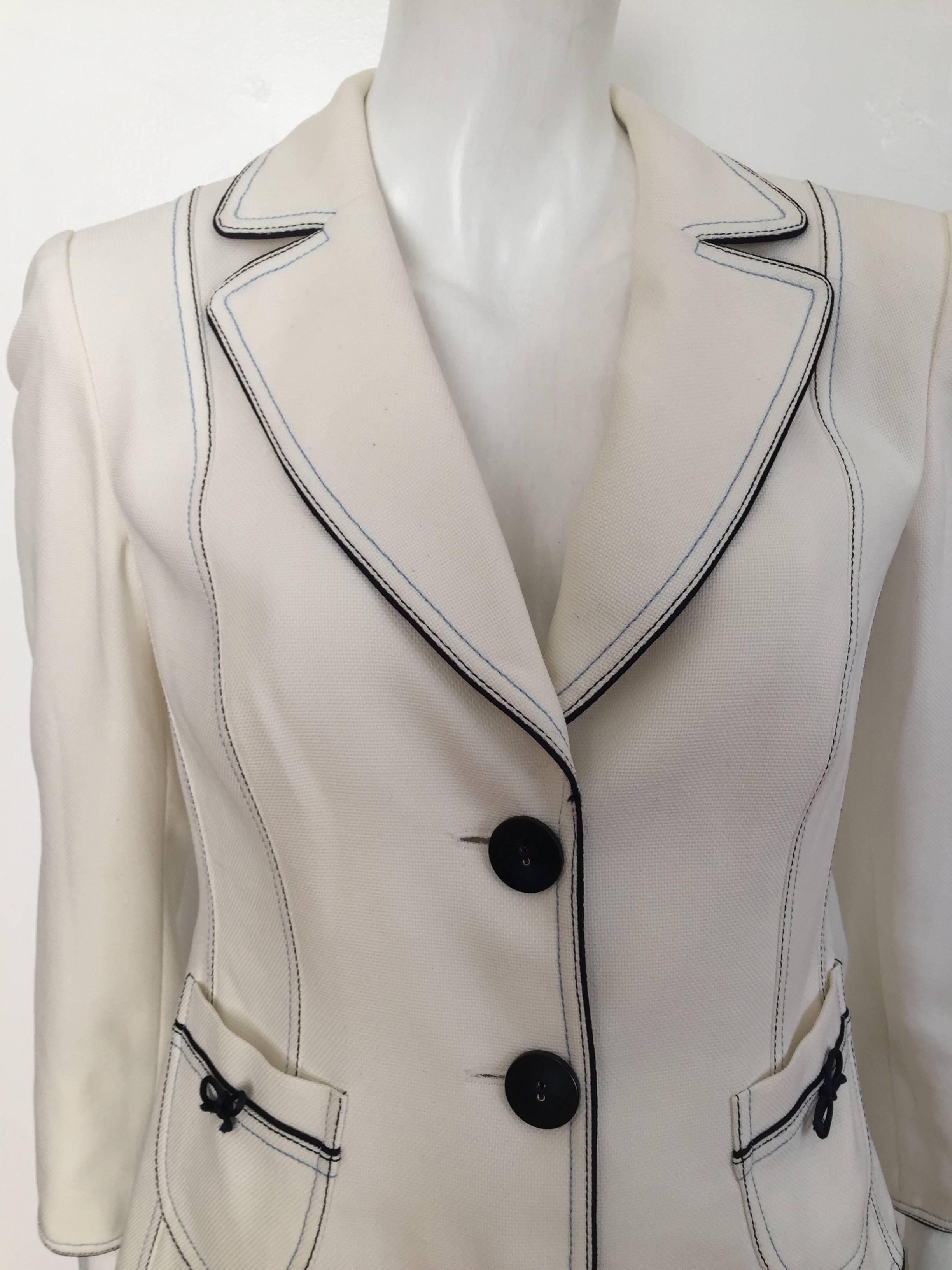 Biba 1990s white cotton jacket is a French size 40 but fits like a USA size 6 (please see & use the measurements below so that you may properly measure your lovely body to make certain this will fit you to perfection). 
Mild shoulder pads.
Two