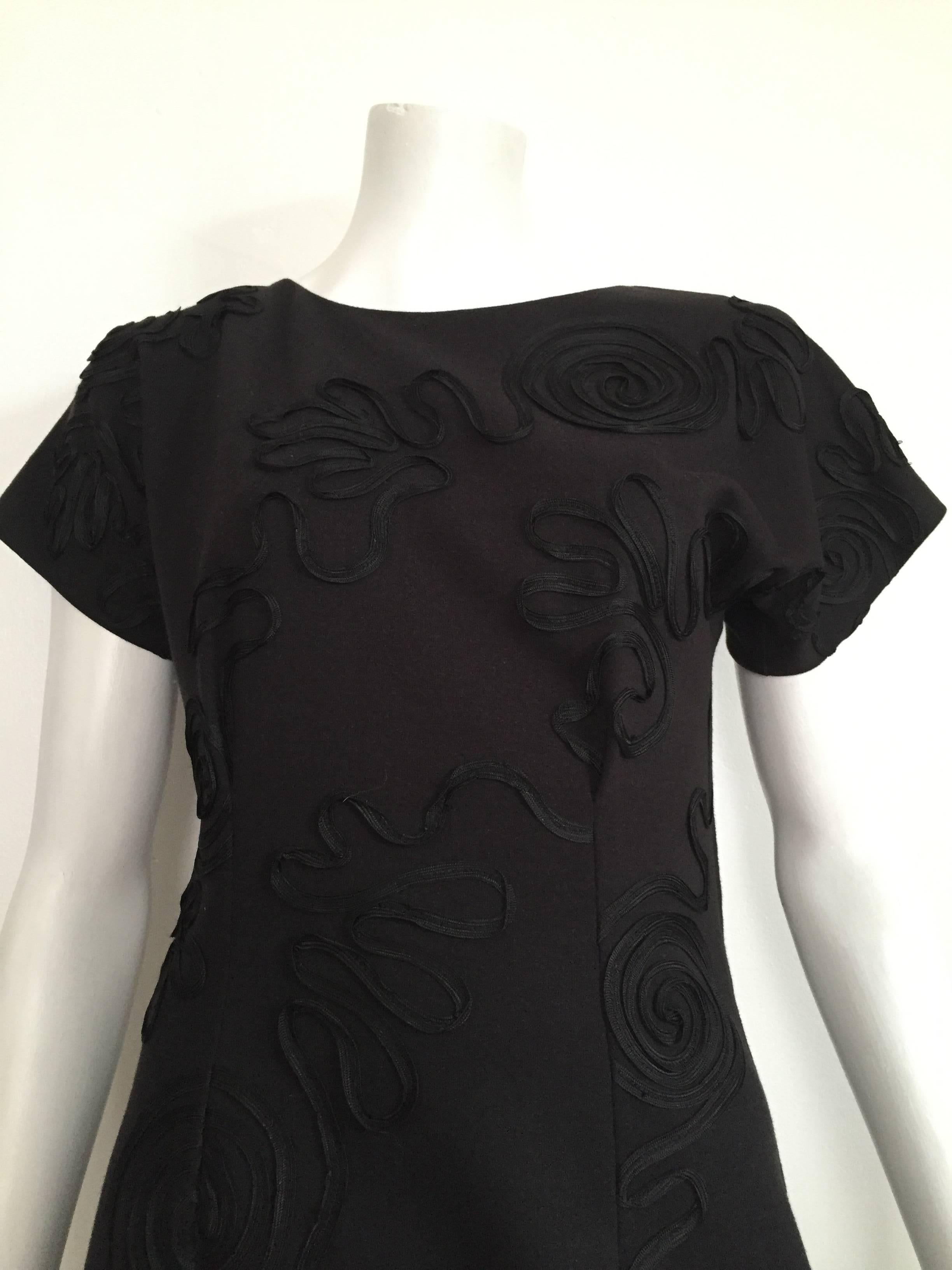 Leo Narducci Studio 1980s cotton little black dress is a size 4.  Front sewn ribbon swirl patterns makes this dress sexy & modern. 
Measurements are:
32" bust
29" waist
36" hips
19" flat across bottom hem of dress
29"