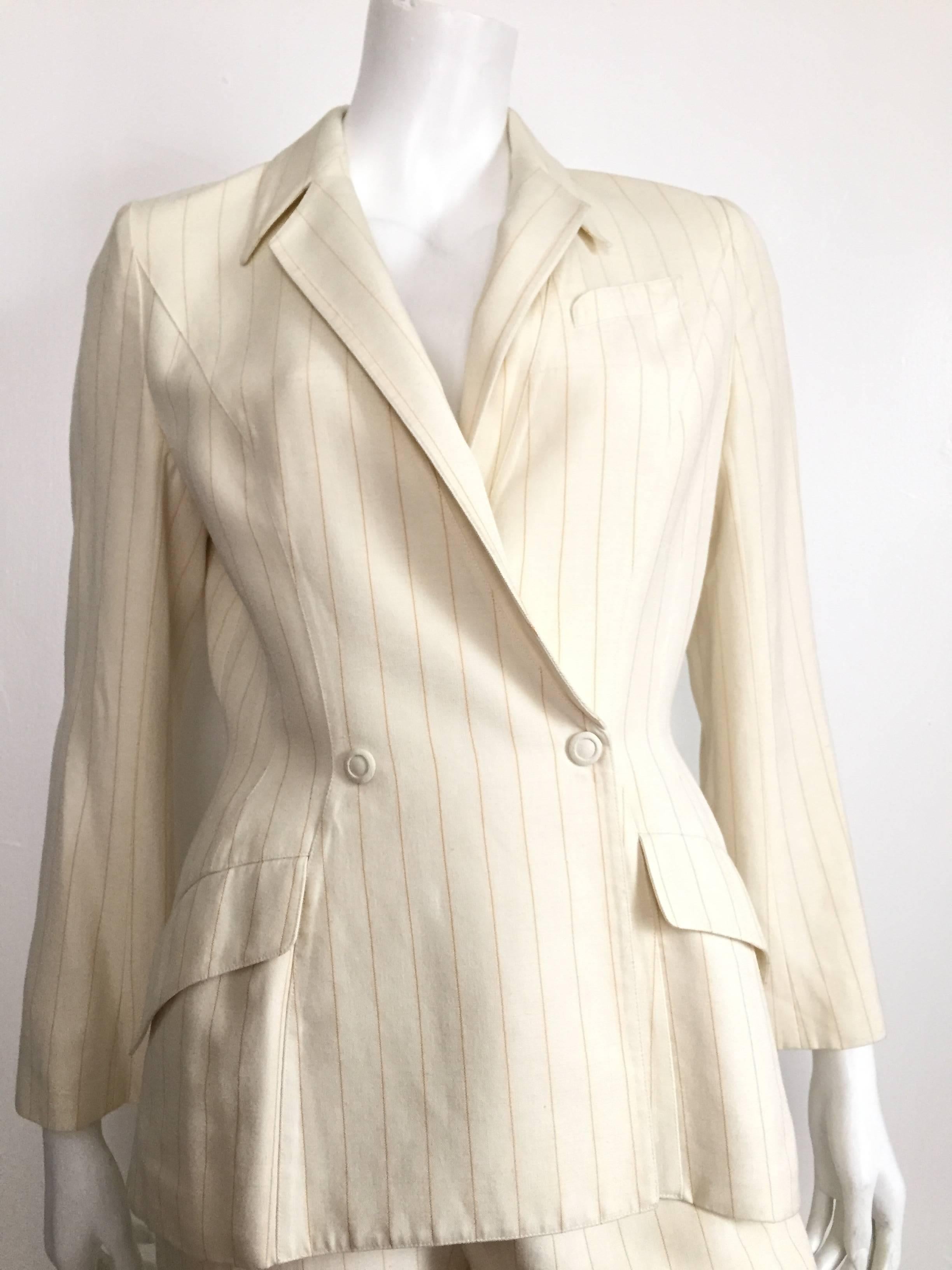 Thierry Mugler 1980s striped cream linen pant suit is a French size 40 and fits like a USA size 6 ( please see & use the measurements below so you can properly measure your body to make sure this suit will fit you to perfection).
Snap button