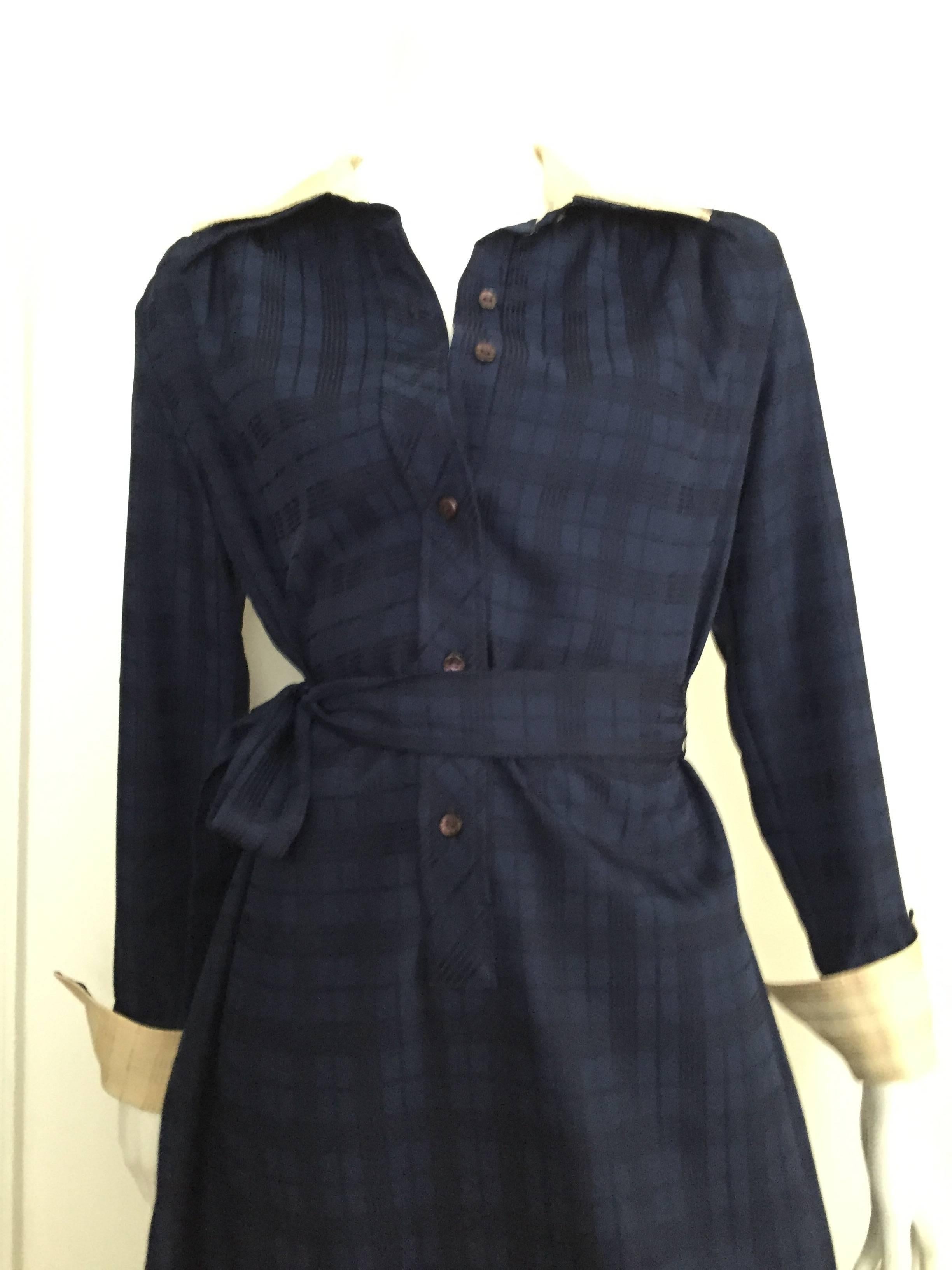 Lanvin 1970s navy plaid shirt dress with tie is a vintage size 16 but fits like a modern USA size 10 / 12.  Please see & use the measurements below so you can properly measure your bust, waist & hips to make certain this will fit you