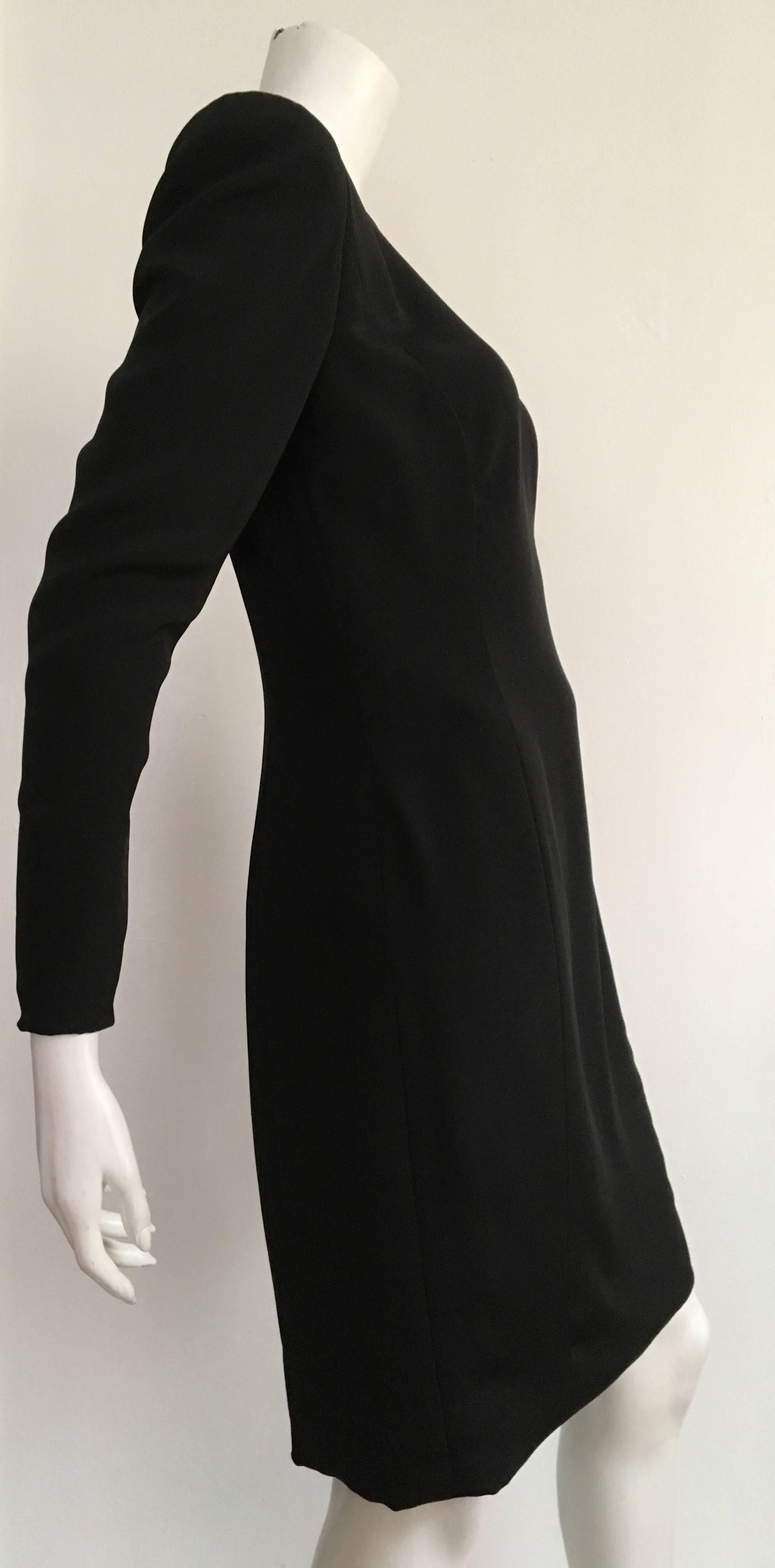 Carolina Herrera 1990s black silk sheath dress size 6.  Please see & use the measurements below so that you can properly measure your lovely body. Classic & stylish LBD is lined with zippers on both sleeves. Mild shoulder pads.
Measurements