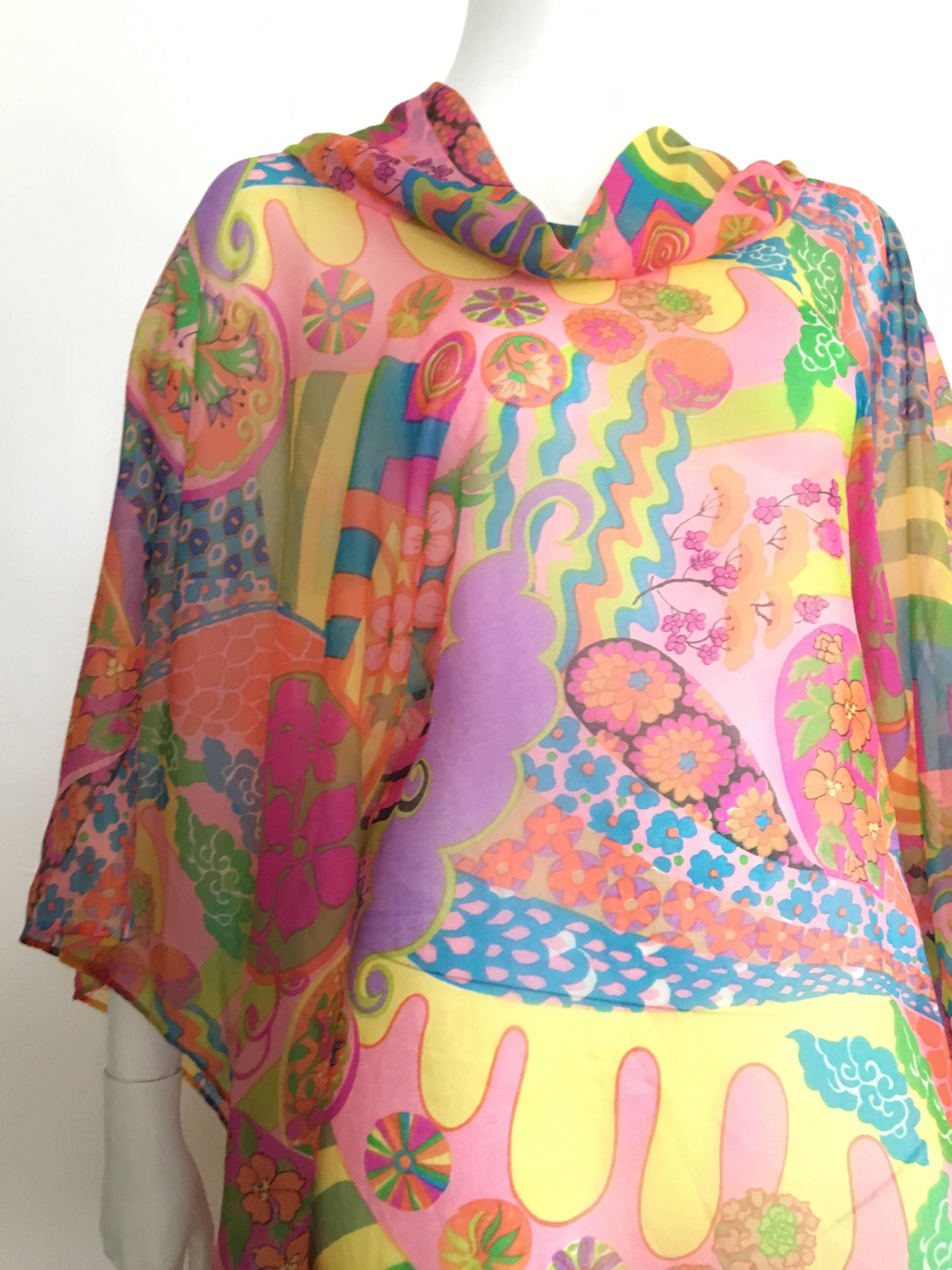 I.Magnin 1960s psychedelic pattern caftan will fit a size 4-6-8.  Please see & use the measurements listed below so that you may properly measure your lovely body to make certain this will fit. Edges are handrolled. Worn with your vintage Celine