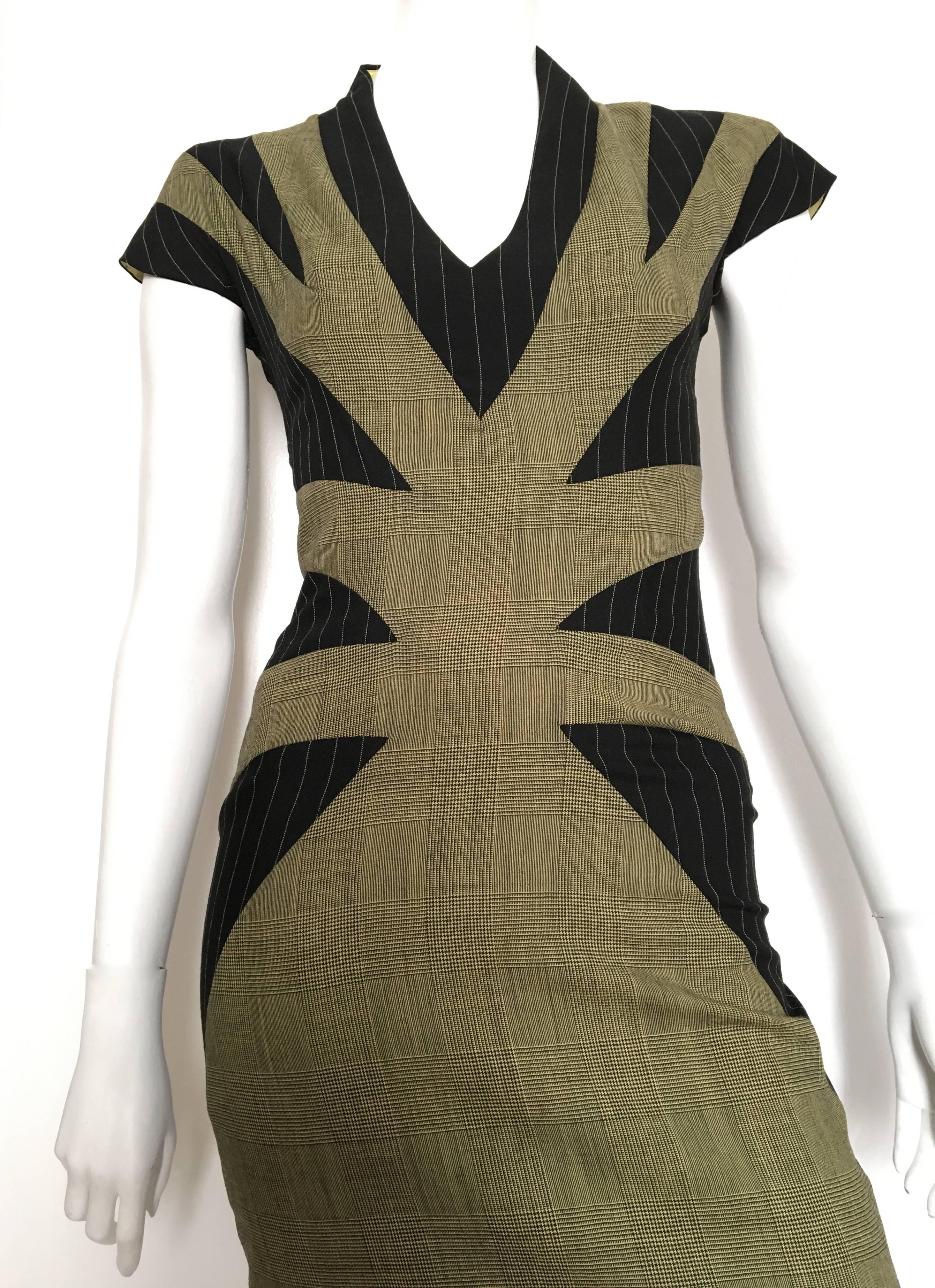 Alexander McQueen 1990s glen plaid with striped pattern wool dress is an Italian size 40 but fits like a USA size 4.  Please see measurements below so that you may properly measure your bust, waist & hips to make certain that this will fit the way