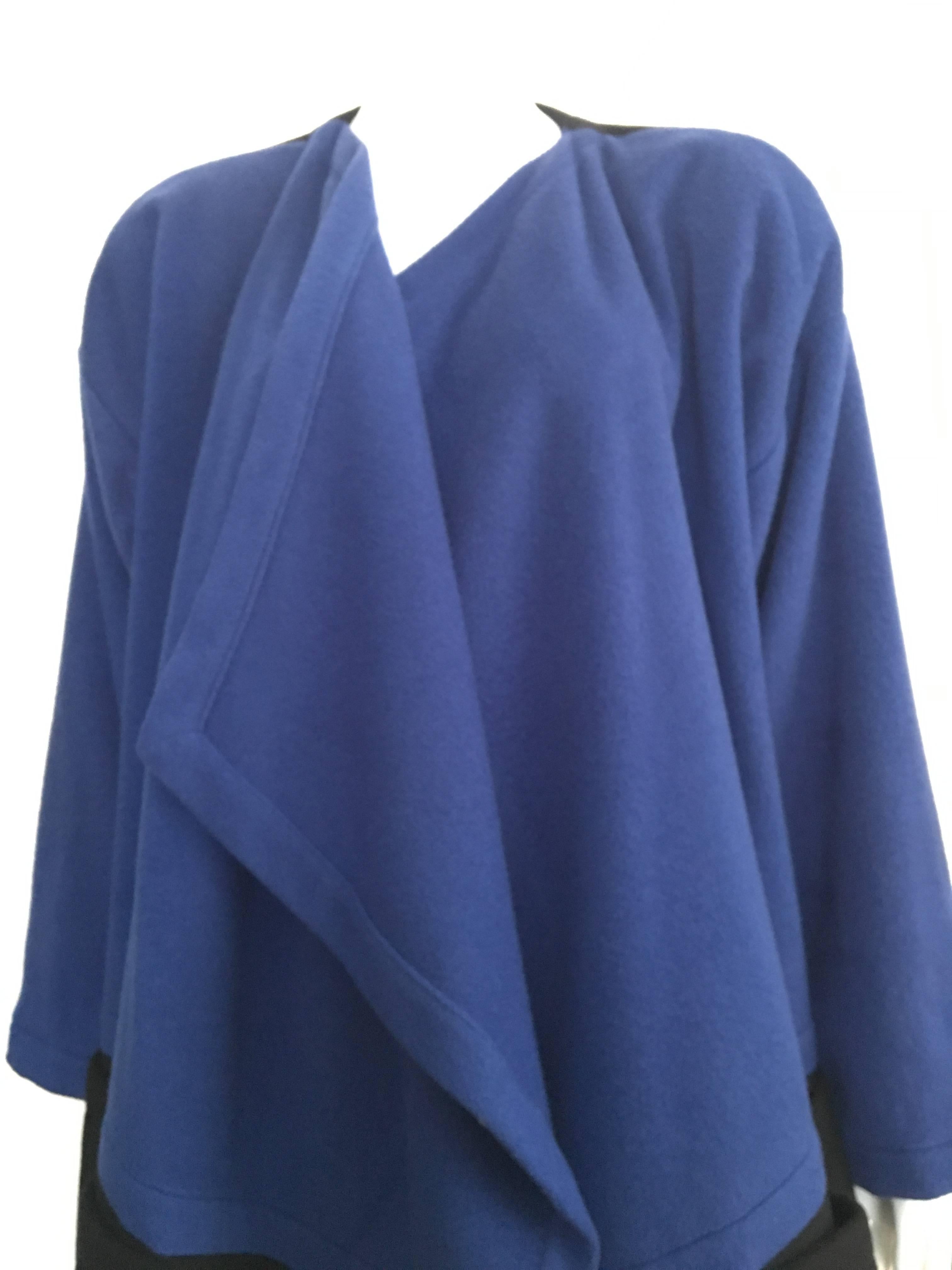 Patrick Kelly Paris 1980s cobalt blue & black wool & cashmere coat will fit a USA size 8 / 10.  This coat is from the private collection of a woman that worked in New York City during the 1980s and wait till you hear her story...  She worked