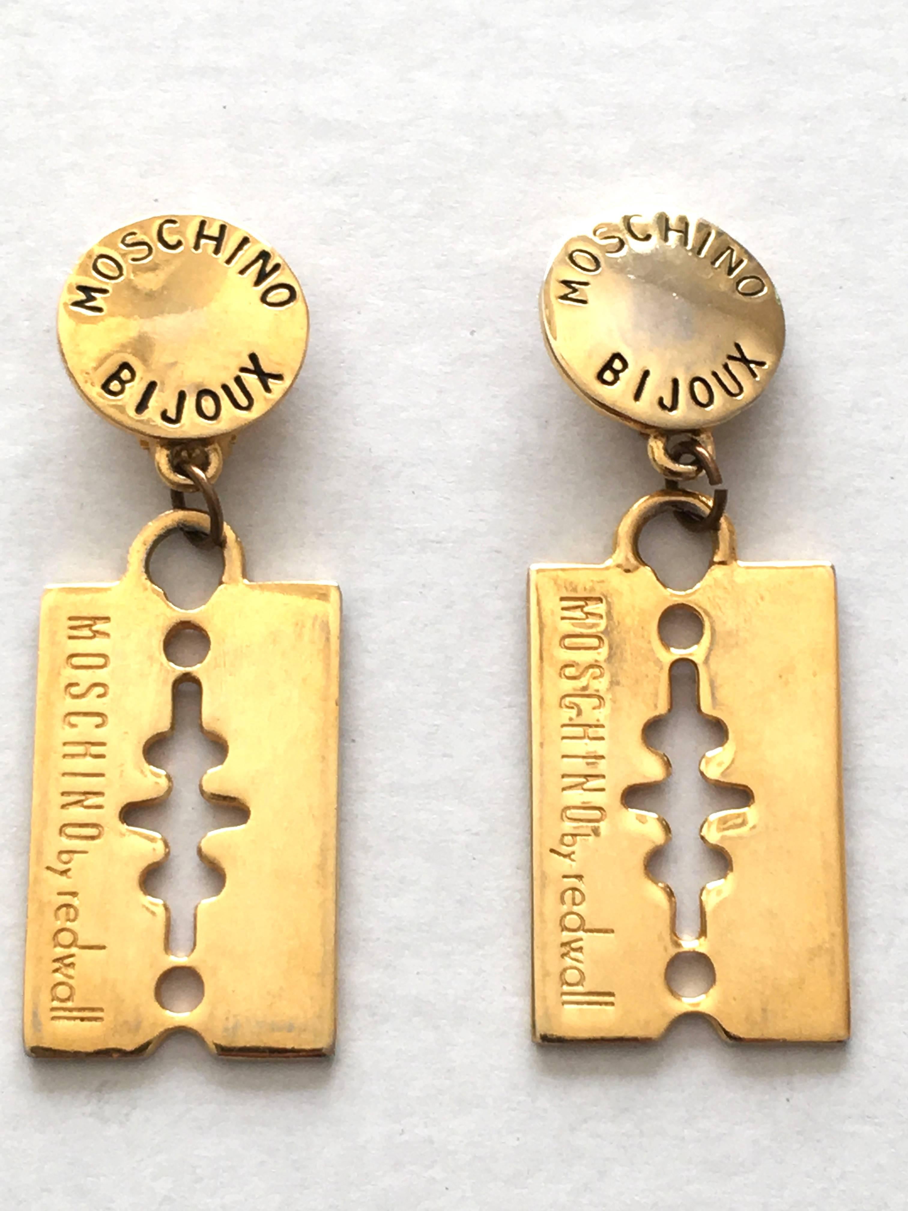 Moschino Bijoux by Redwall1980s gold razor blade dangle clip on earrings. 
These are from the private collection of a runway model that used to wear these out night clubbing in Paris back in the 80s. They have stories to tell, if only they could