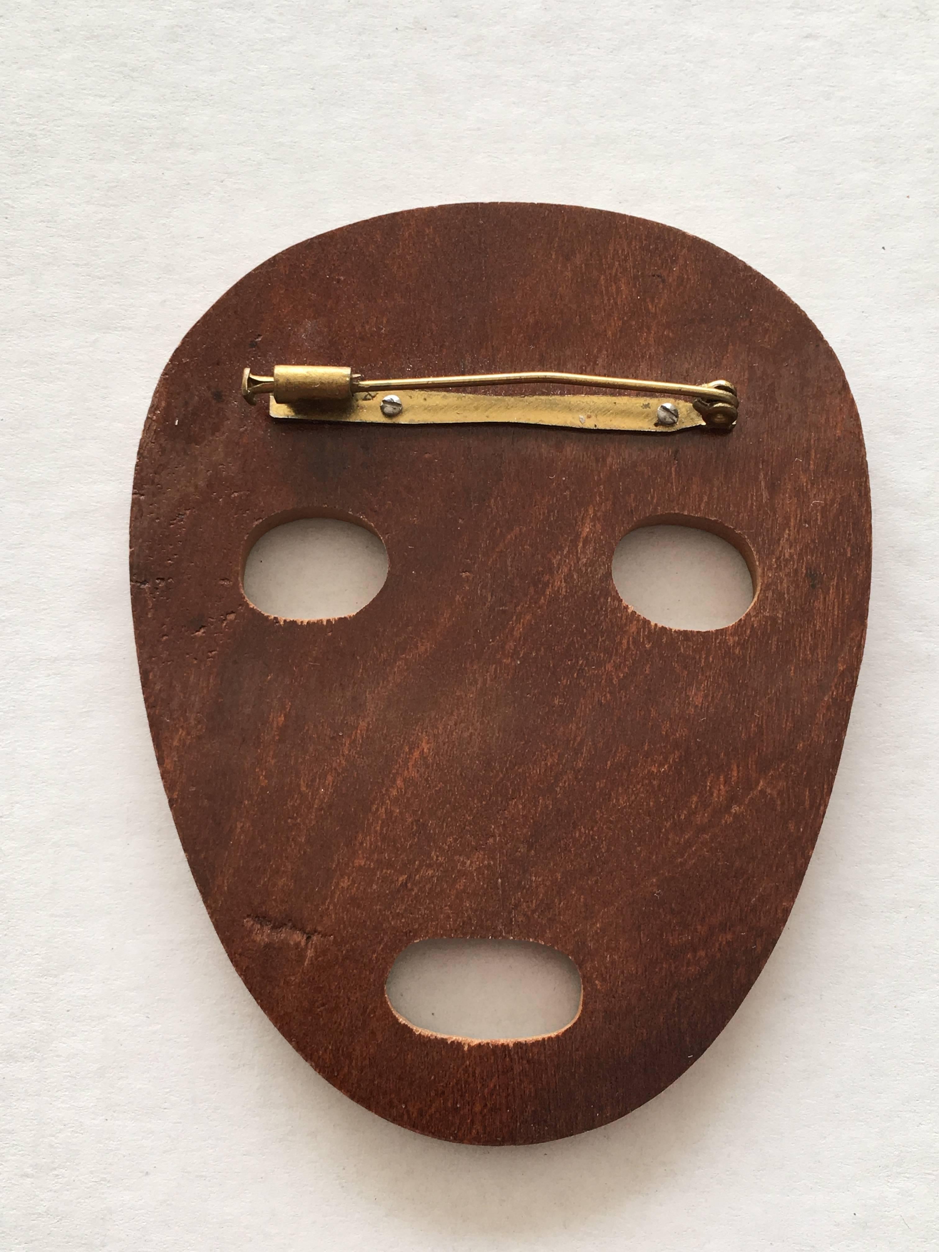 Patrick Kelly Paris 1989 African Wooden Face Cutout Pin.  For Sale 1