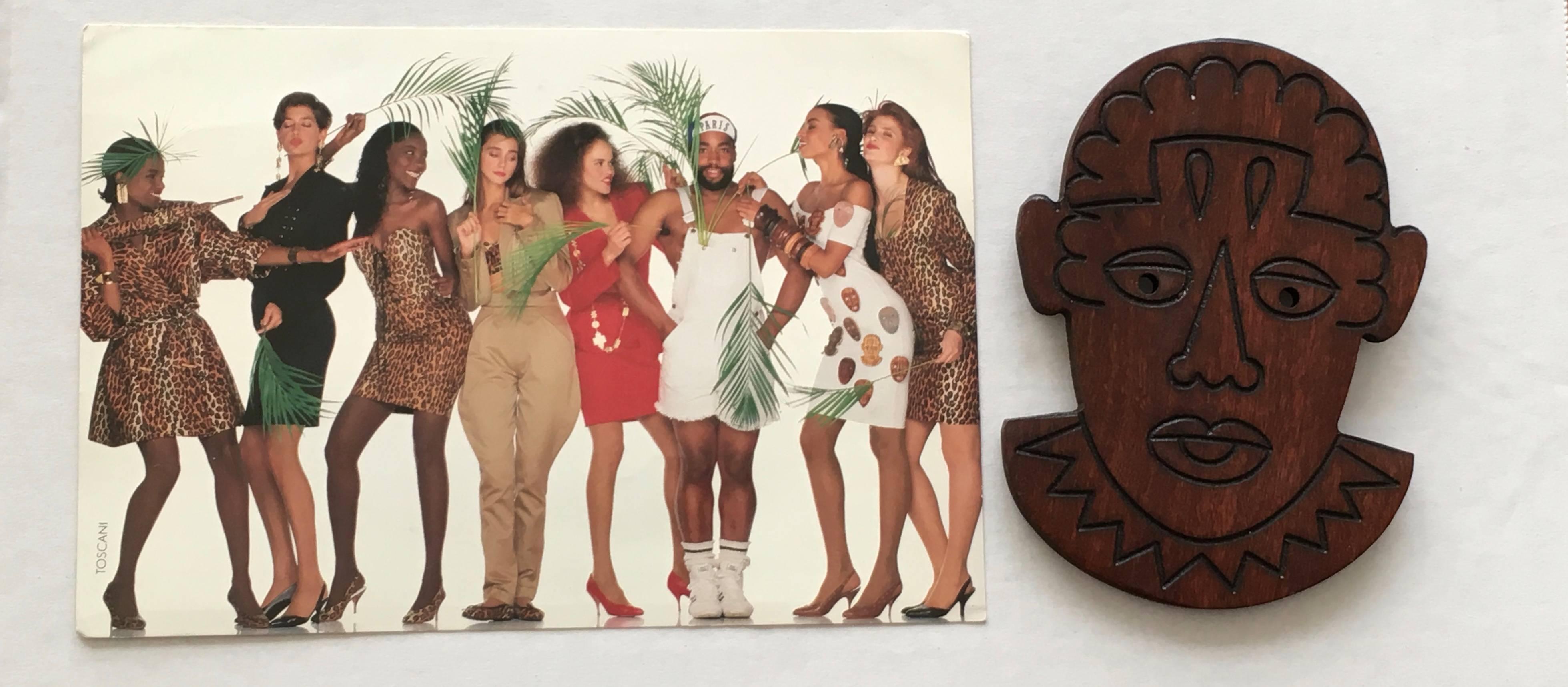 Patrick Kelly Paris 1989 African wooden face cutout pin / brooch. 
This is from the private collection of one of Patrick Kelly's lifelong friend & model, Carol Martin, from Atlanta, GA. Carol Martin modeled in the Patrick Kelly 1989 Spring