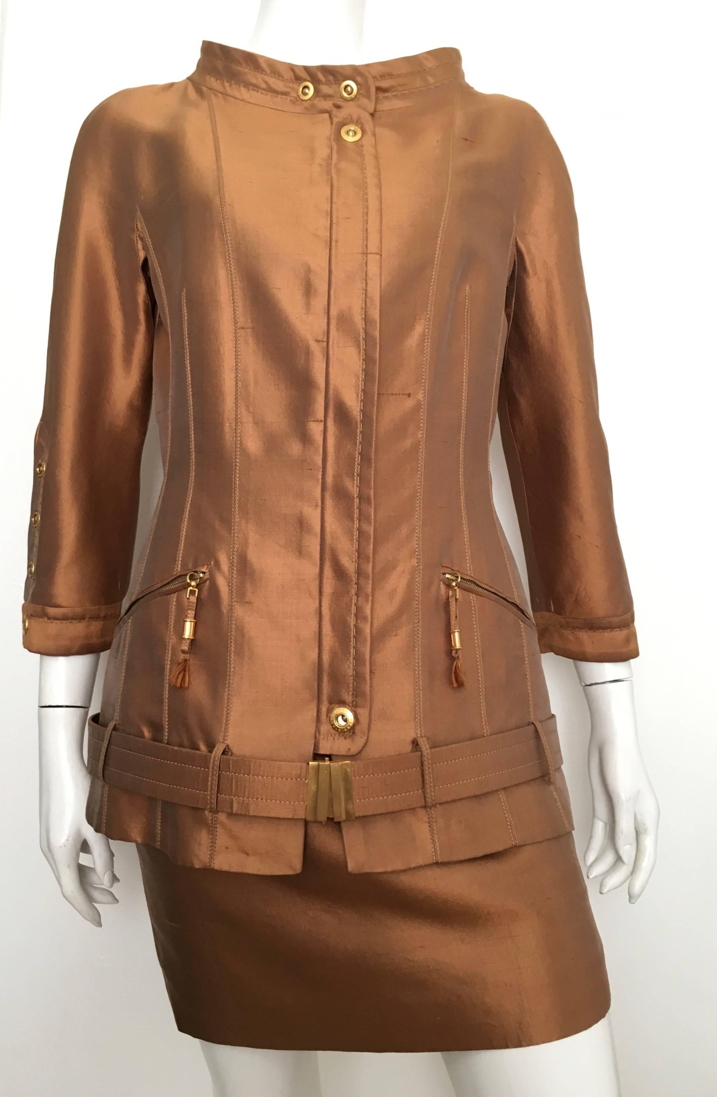 Gianfranco Ferre 1990s silk copper metallic skirt & jacket is a USA size 4.  The jacket is an Italian size 44 and the skirt is a size 40. Ladies please use your tape measure so that you can use the measurements listed below to properly measure your