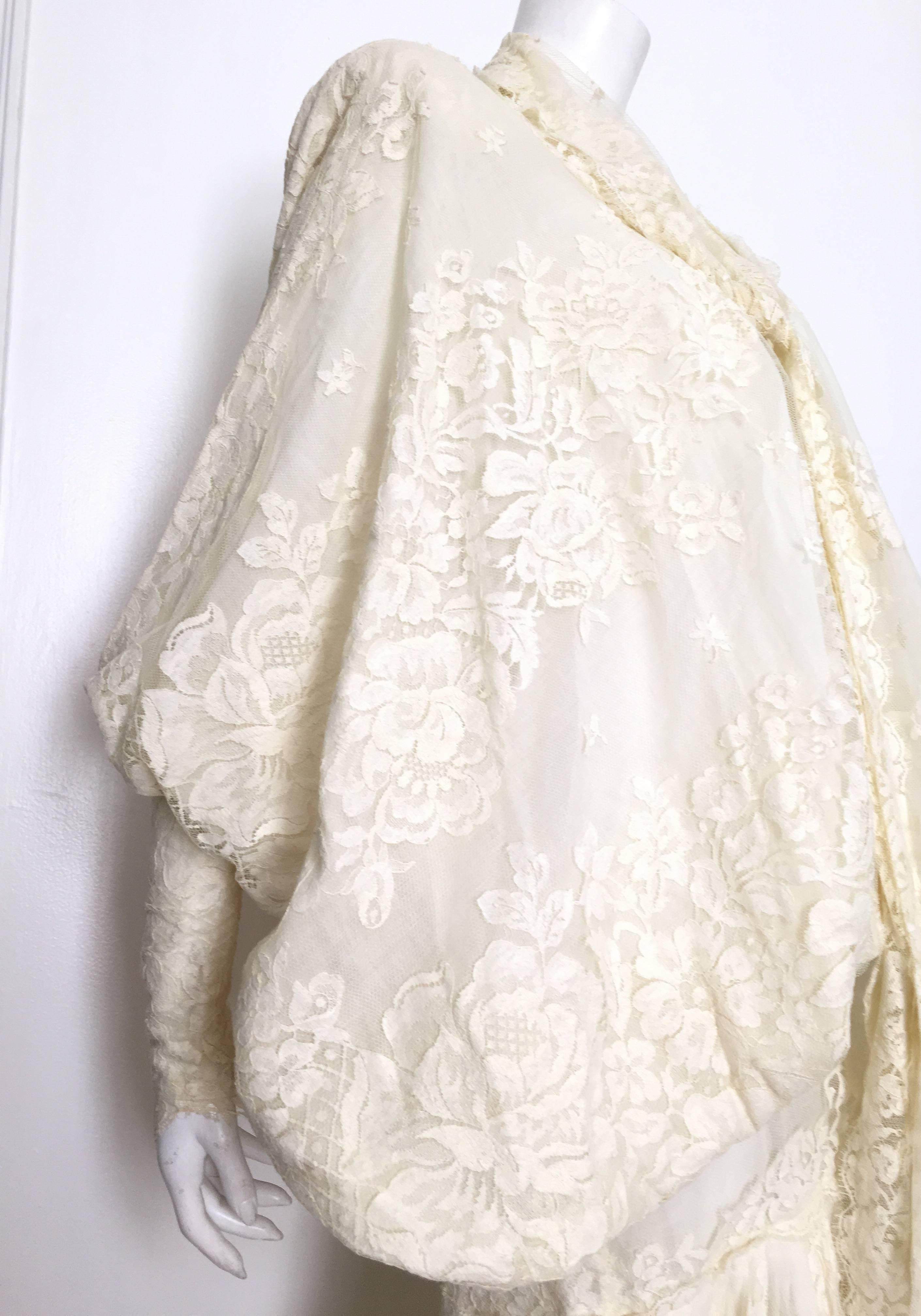 Norma Kamali OMO 1984 cream lace wedding gown / dress is an original size 12 but fits like a modern USA size 10.  Ladies please use your tape measure so that you can properly measure your bust, waist & hips to make certain that this will fit your