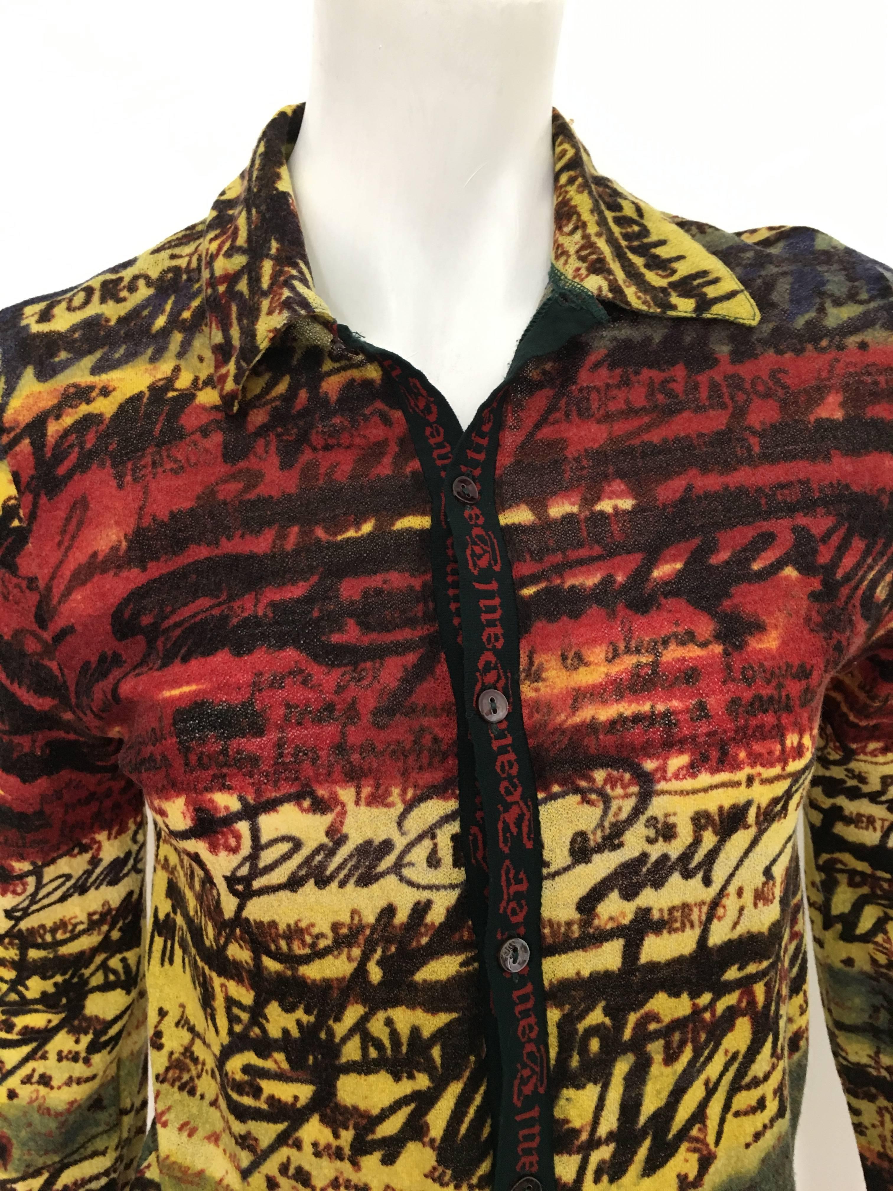 Jean Paul Gaultier Maille Classique 2000s mens knit wool button up shirt is a size small.  This is a perfect example of a unisex shirt, both sexes should be able to enjoy this and wear it with style.
Measurements are:
32