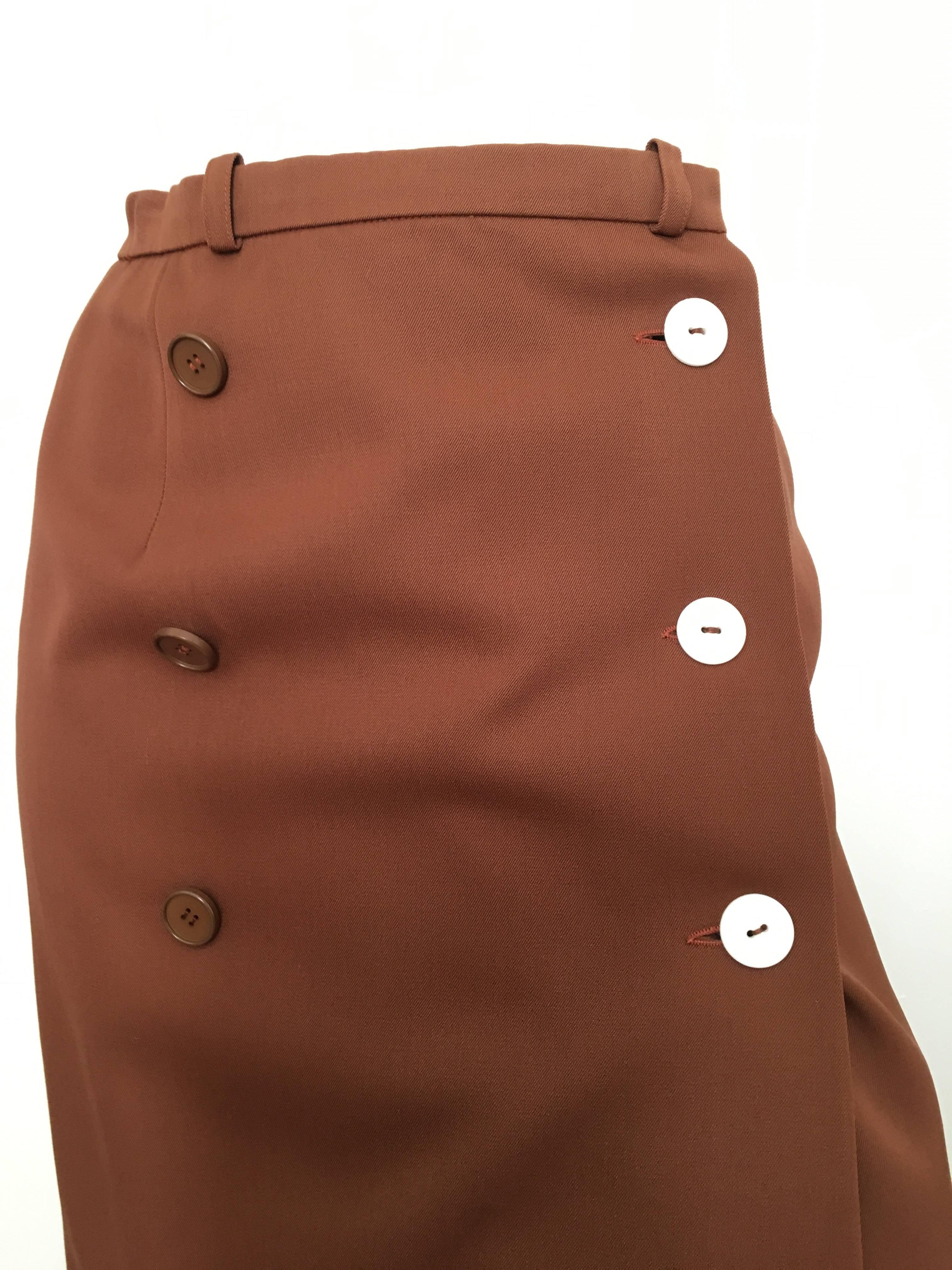 Valentino Boutique 1970s brown wool wrap skirt is a vintage size 8 but fits like a modern USA size 4.  Ladies please take out that measuring tape and properly measure your waist so you know this will fit you properly when it arrives.  Brown silk