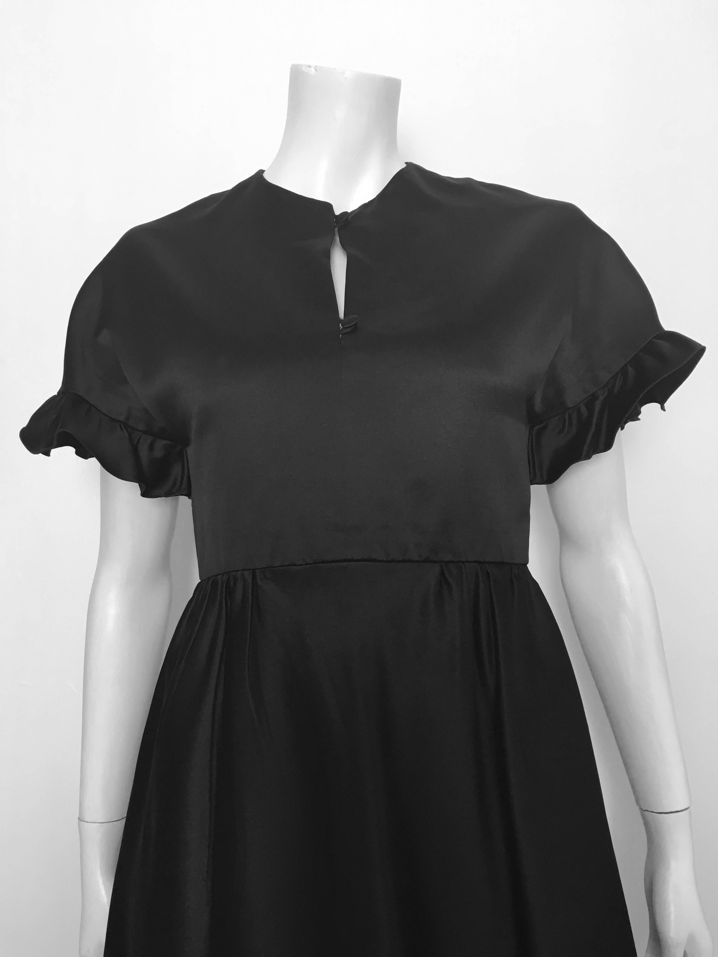 Valentino Boutique 1960s black silk cocktail evening dress with pockets is a size 4.  Ladies please use your measuring tape so you can properly measure your bust, waist & hips so you know this gorgeous vintage piece will fit your body to