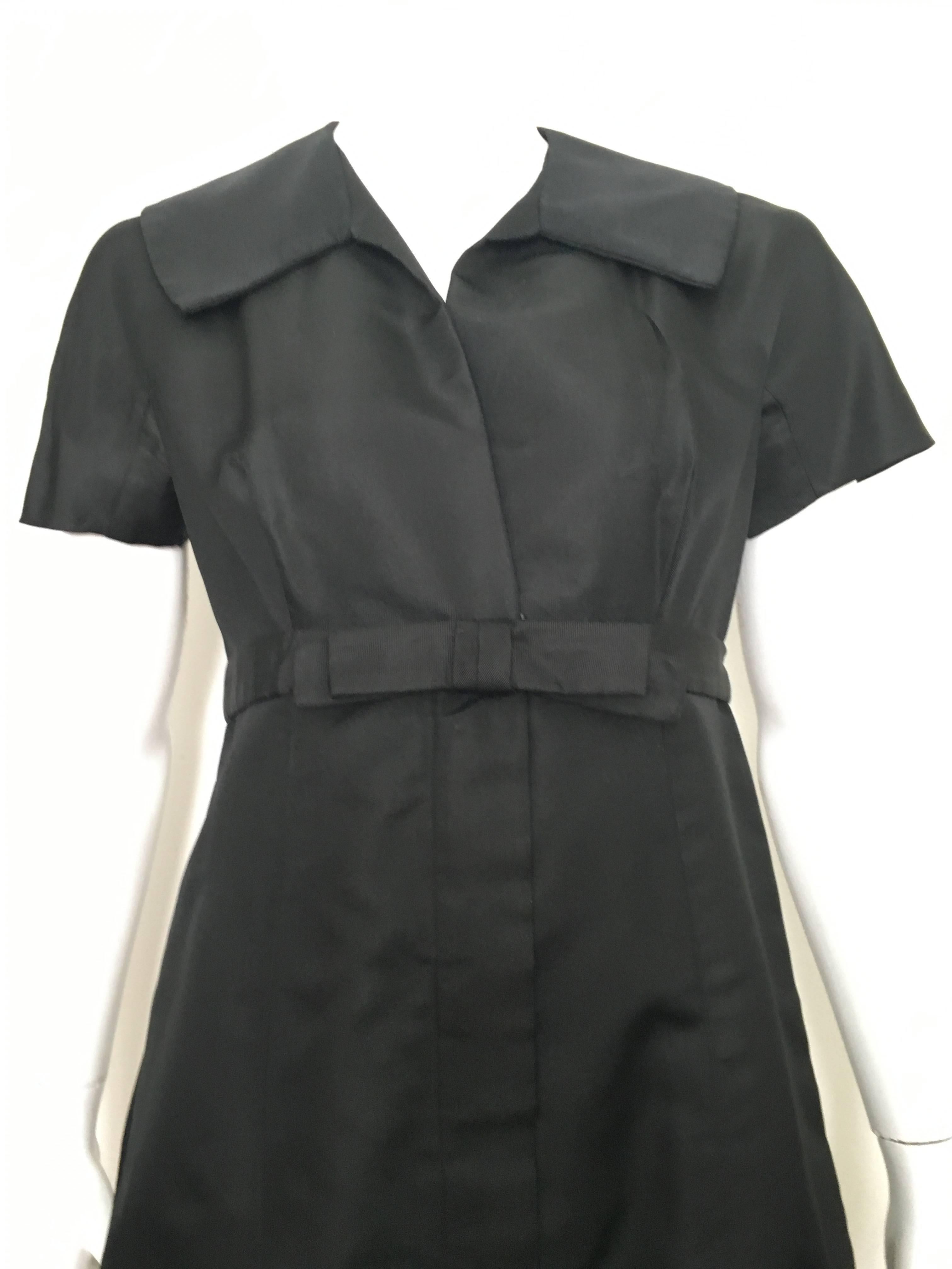 Malcolm Charles designed by Frank Adams 1960s short sleeve black silk taffeta dress is a size 6. Ladies please pull out your measuring tape so you can properly measure your bust, waist & hips to make certain this vintage treasure will fit your