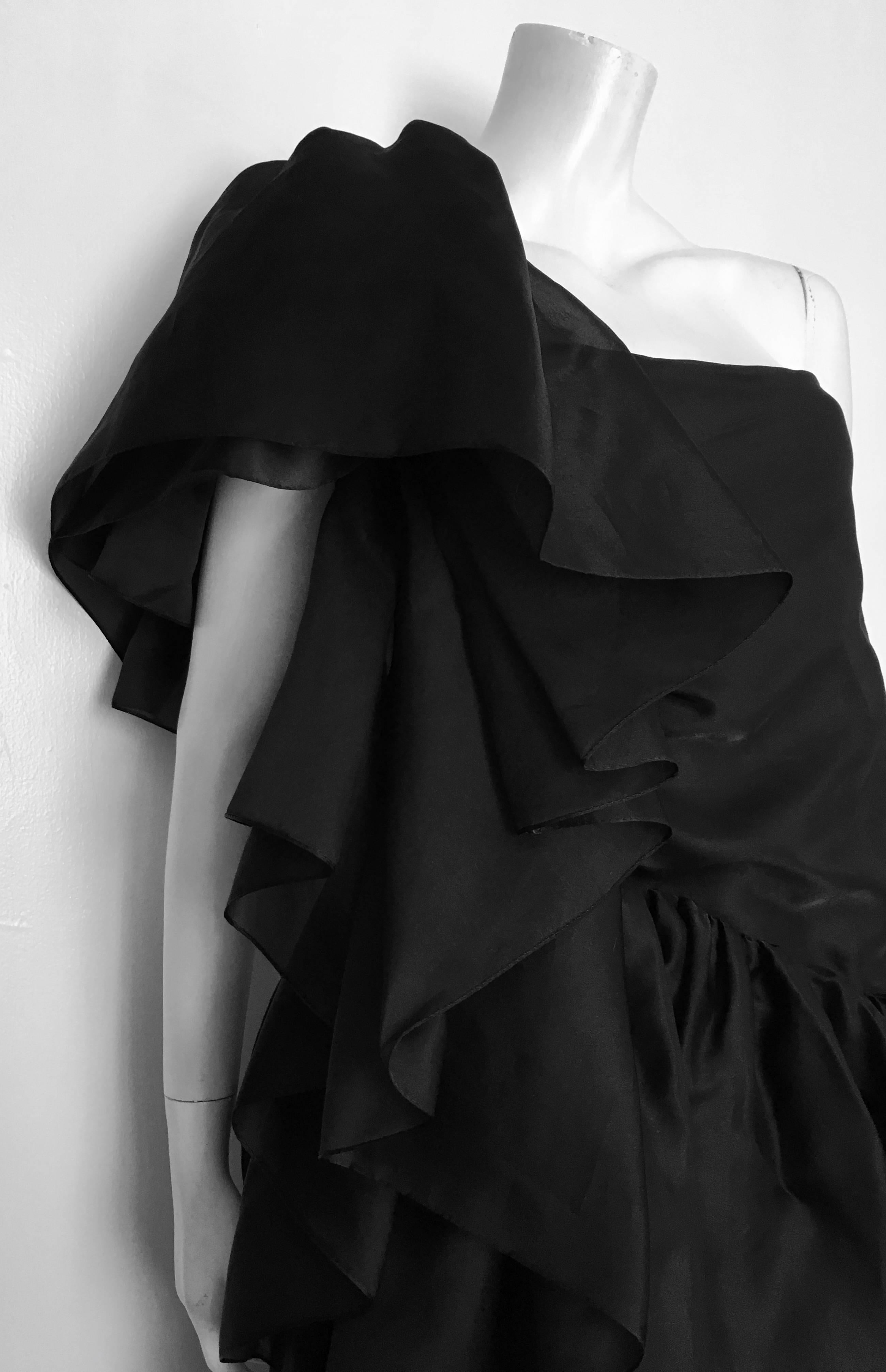 Mollie Parnis New York 1950s black satin layered one shoulder gown is a vintage size 8.  
Ladies please use your measuring tape so you can properly measure your bust, waist & hips so you know this will fit your lovely body perfectly.  
This is an