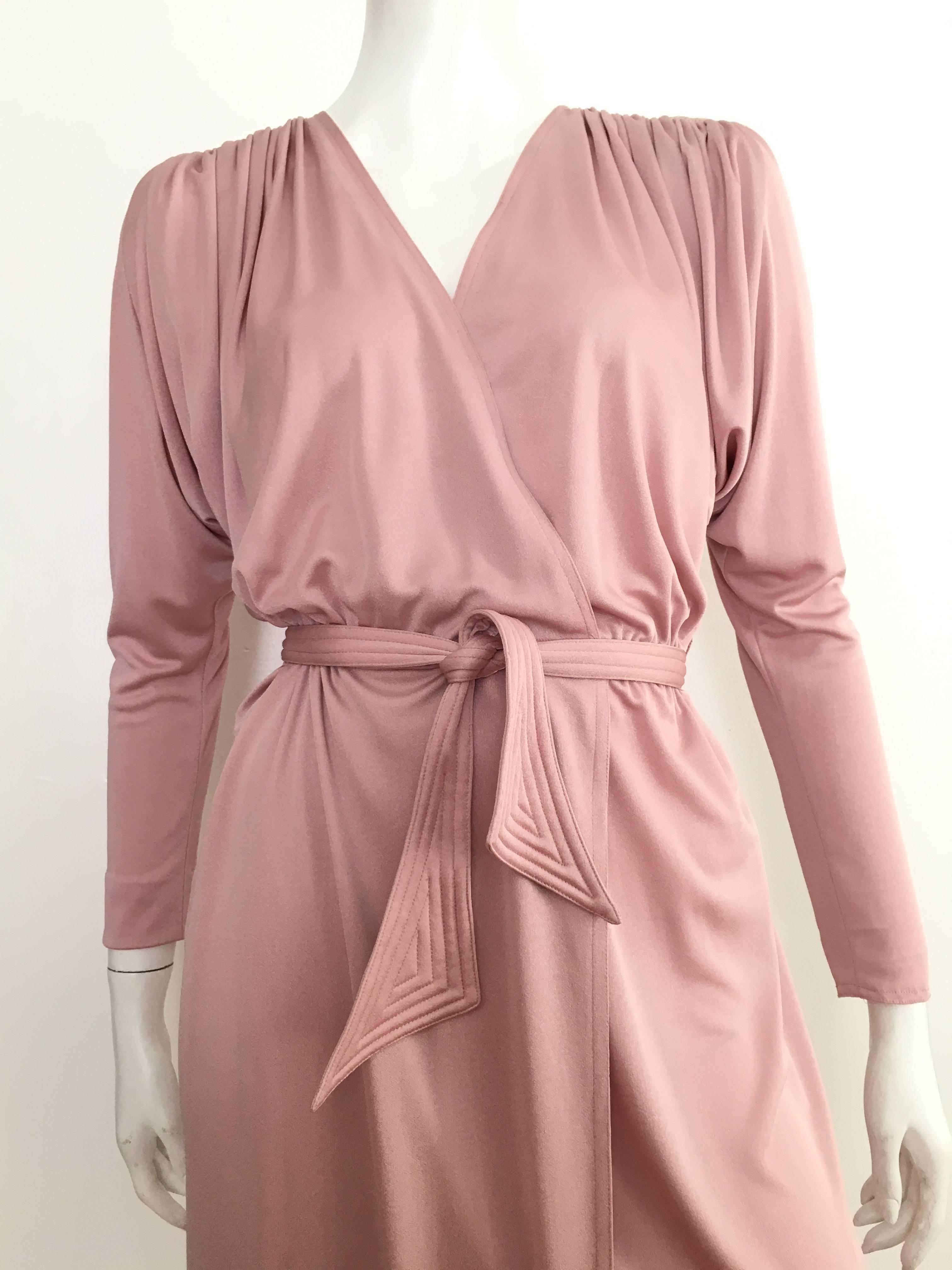 Pierre Cardin early 1980s faux wrap pink champagne dolman sleeves with belt with pockets dress is a size 8.  Ladies please use your measuring tape so you can properly measure your bust, waist & hips so you know for certain this vintage piece will
