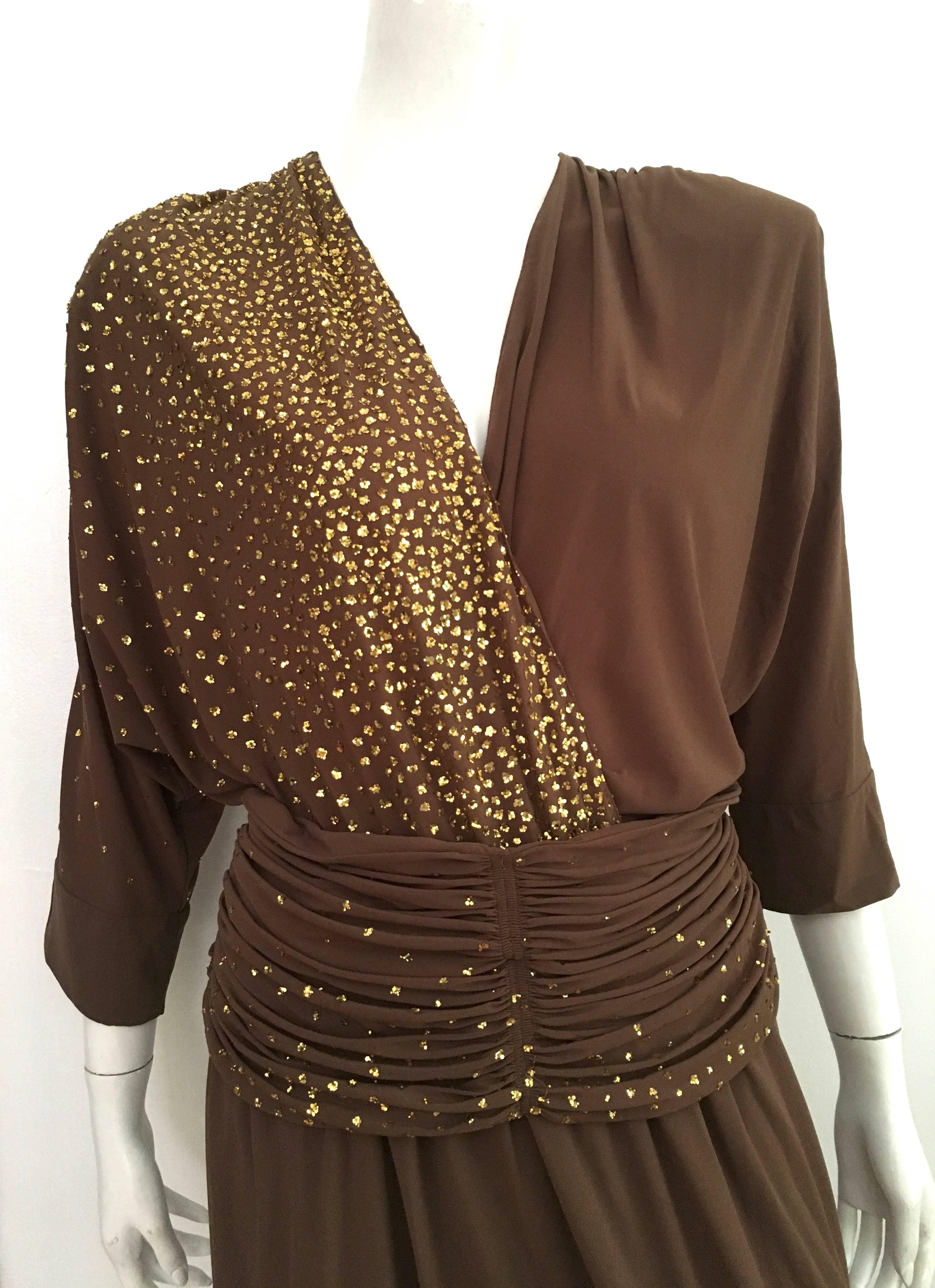 Lillie Rubin 1980s long brown stretch gown with gold glitter specks on one side is a size 14 but fits like a size 12.  Ladies please use your measuring tape so you can properly measure your bust, waist & hips to make certain this vintage treasure