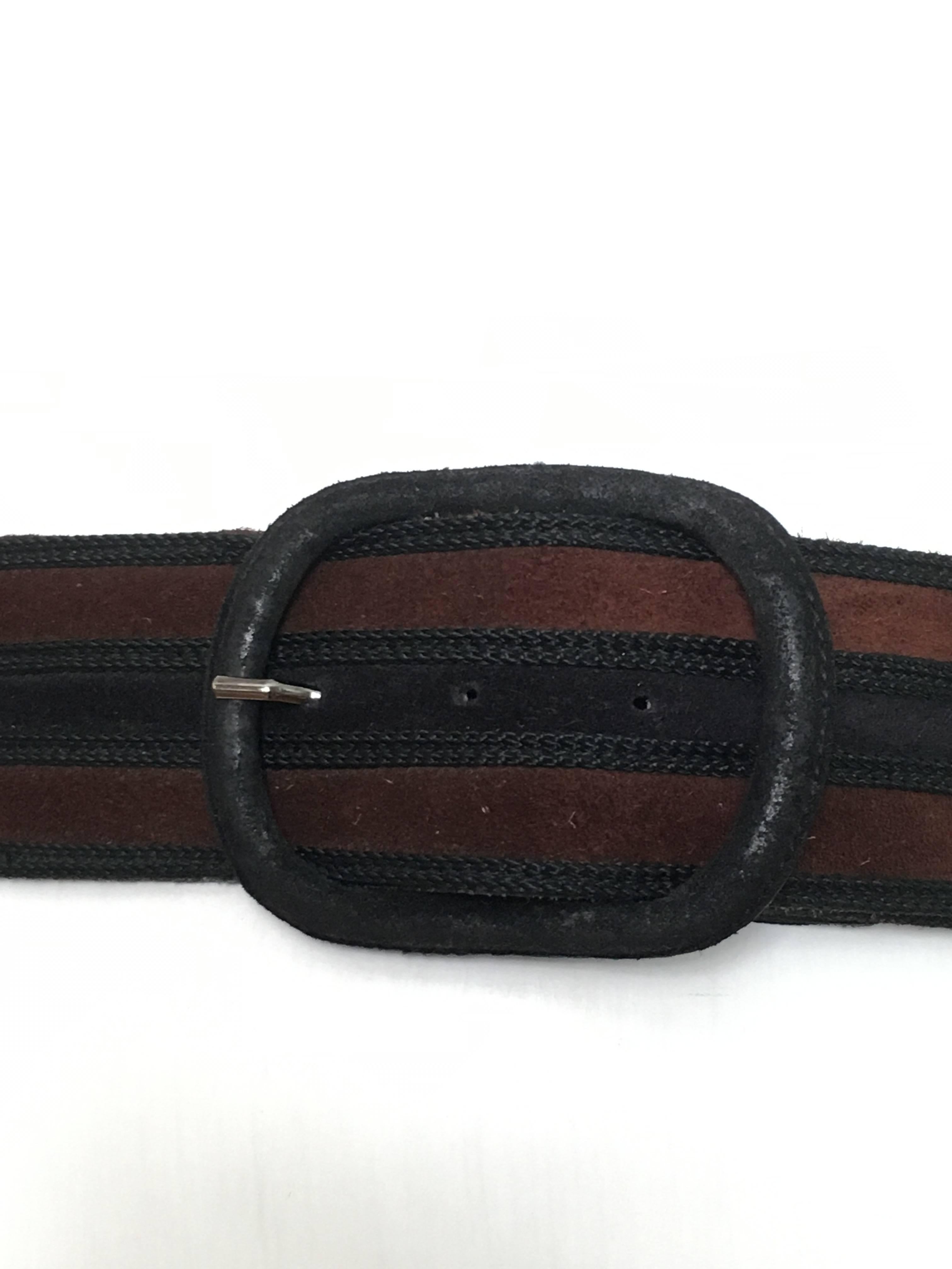 Yves Saint Laurent 1980s black brown leather belt. 
Belt is marked medium but fits like a small and this is a waist belt not a belt that goes through the loops. 
Belt is 31