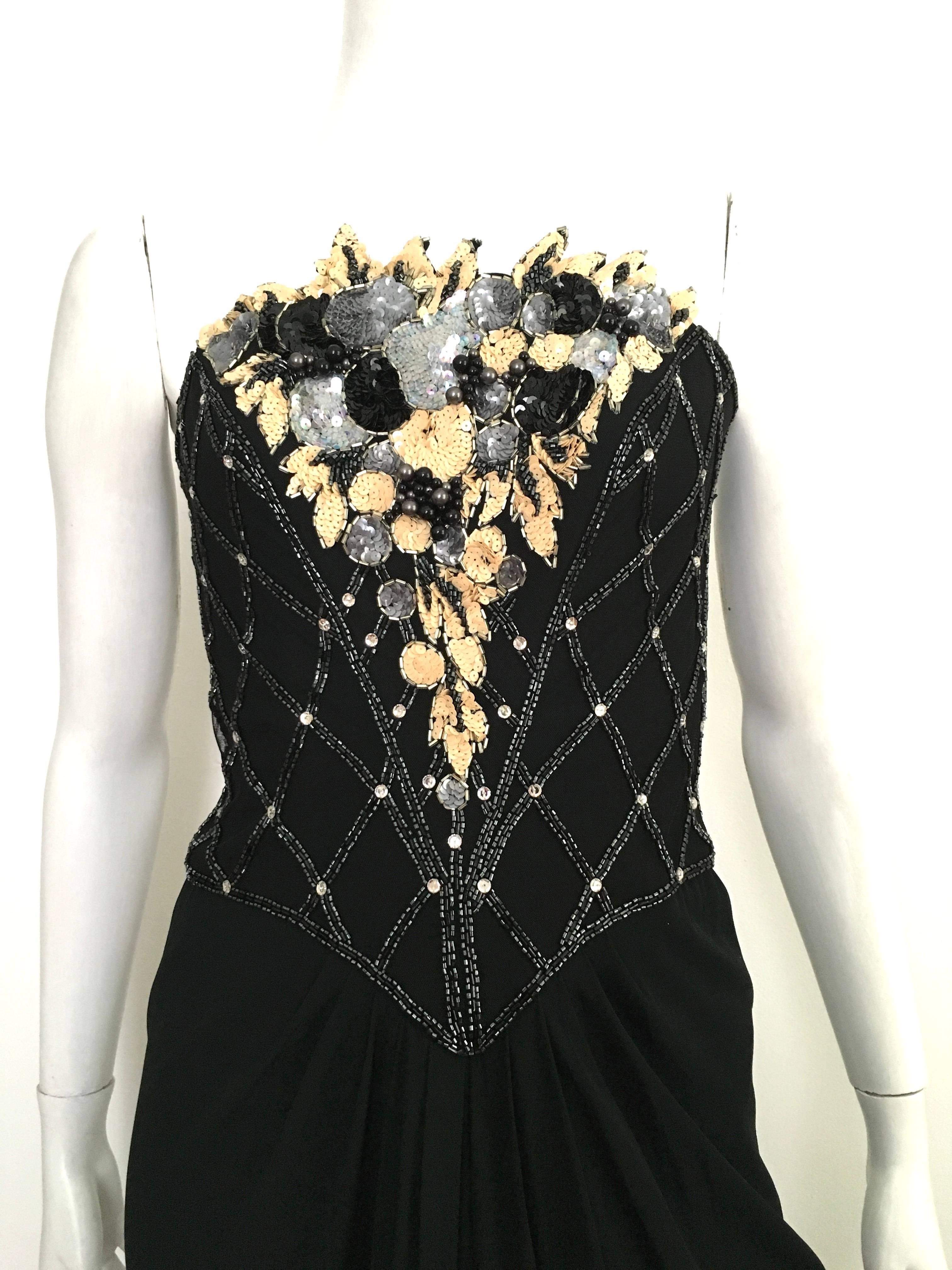 Bob Mackie 1980s black sequin & beading strapless gown is a size 6.  This gown has a waist line of 29