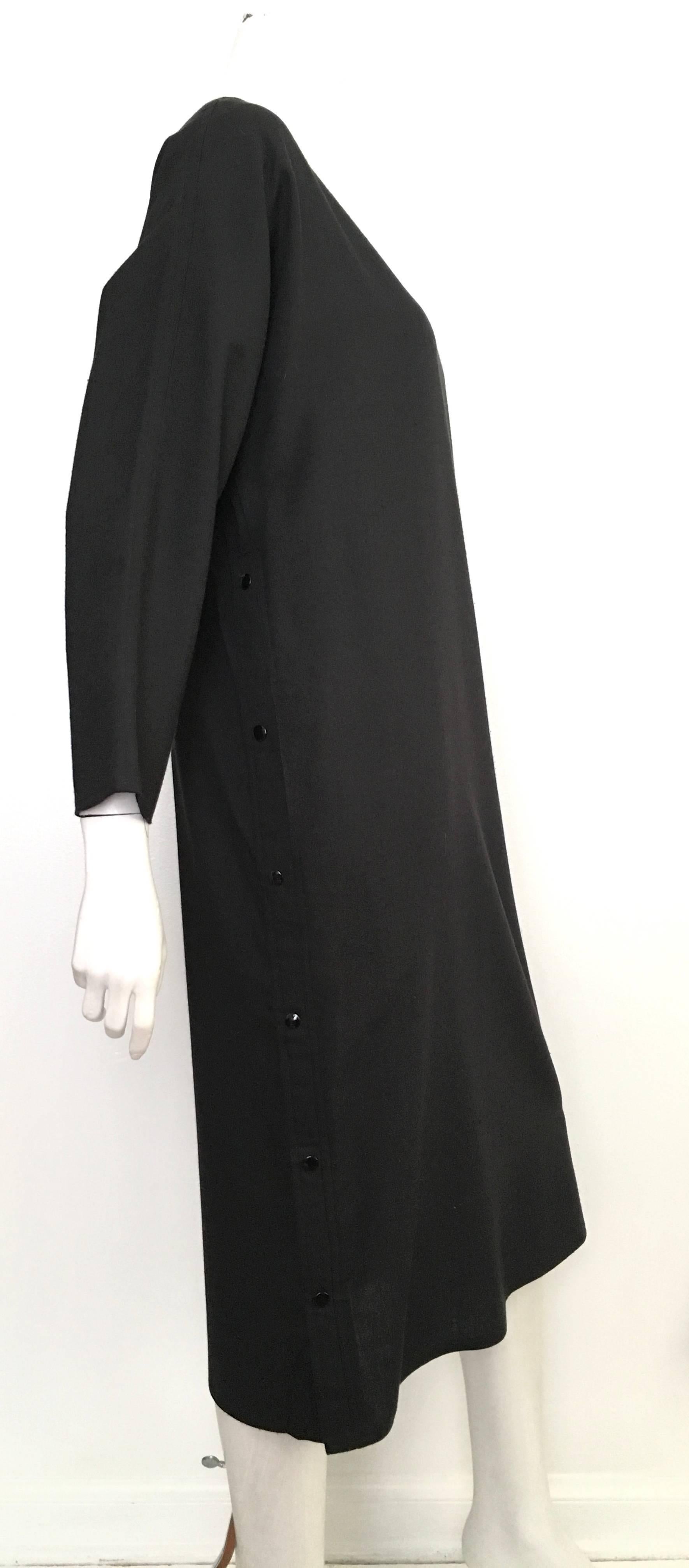 Geoffrey Beene for Gallant 1980s black linen dress with pockets and side snap buttons is a size 12.  This vintage gem will look amazing on any woman that is at least 5'8