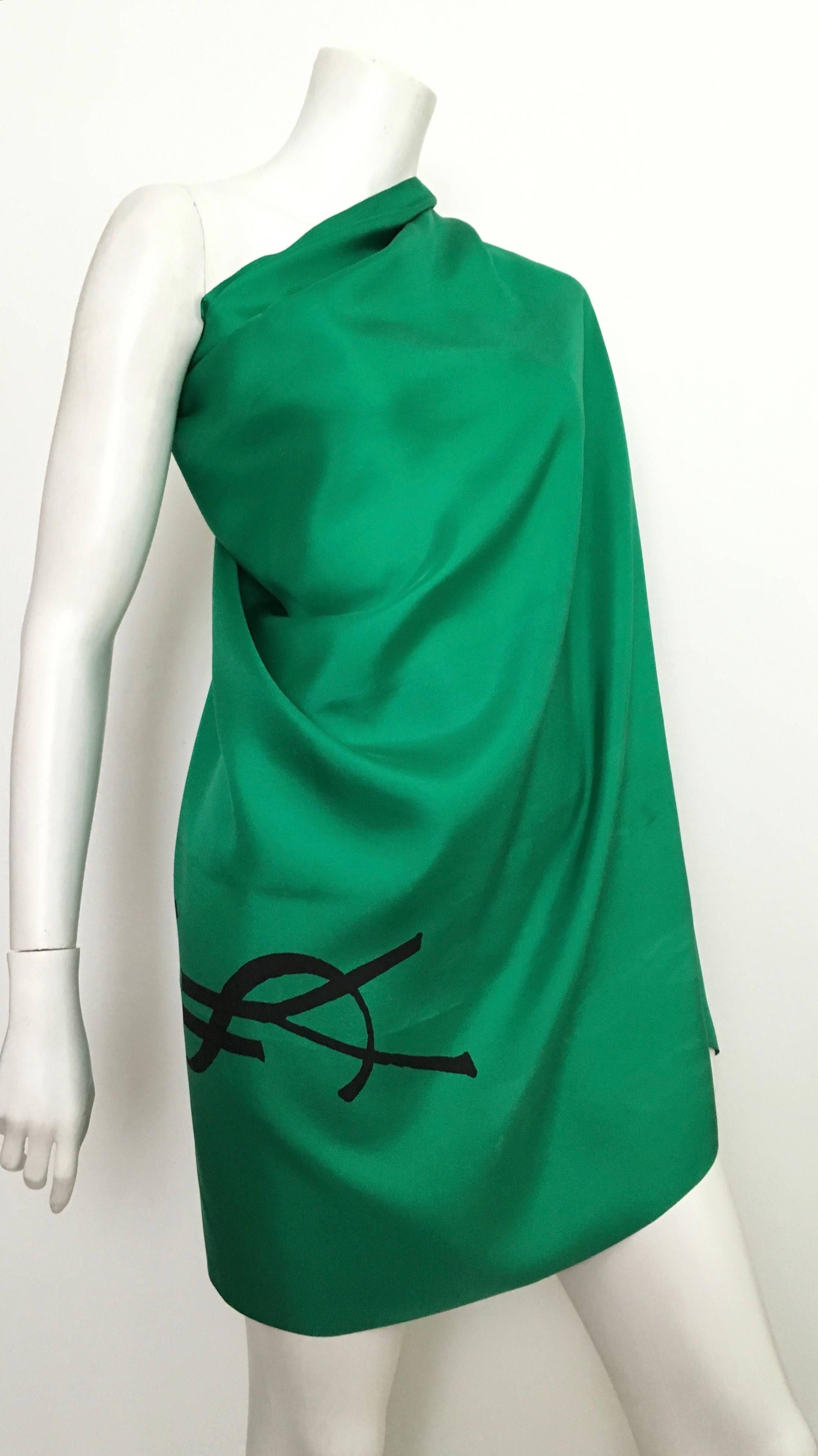 Yves Saint Laurent 1980s emerald green large silk scarf made in France.  The Made in France label is missing on this scarf.  This is from the private collection of a wealthy Atlanta woman, this one as well as the red one I have listed as well were