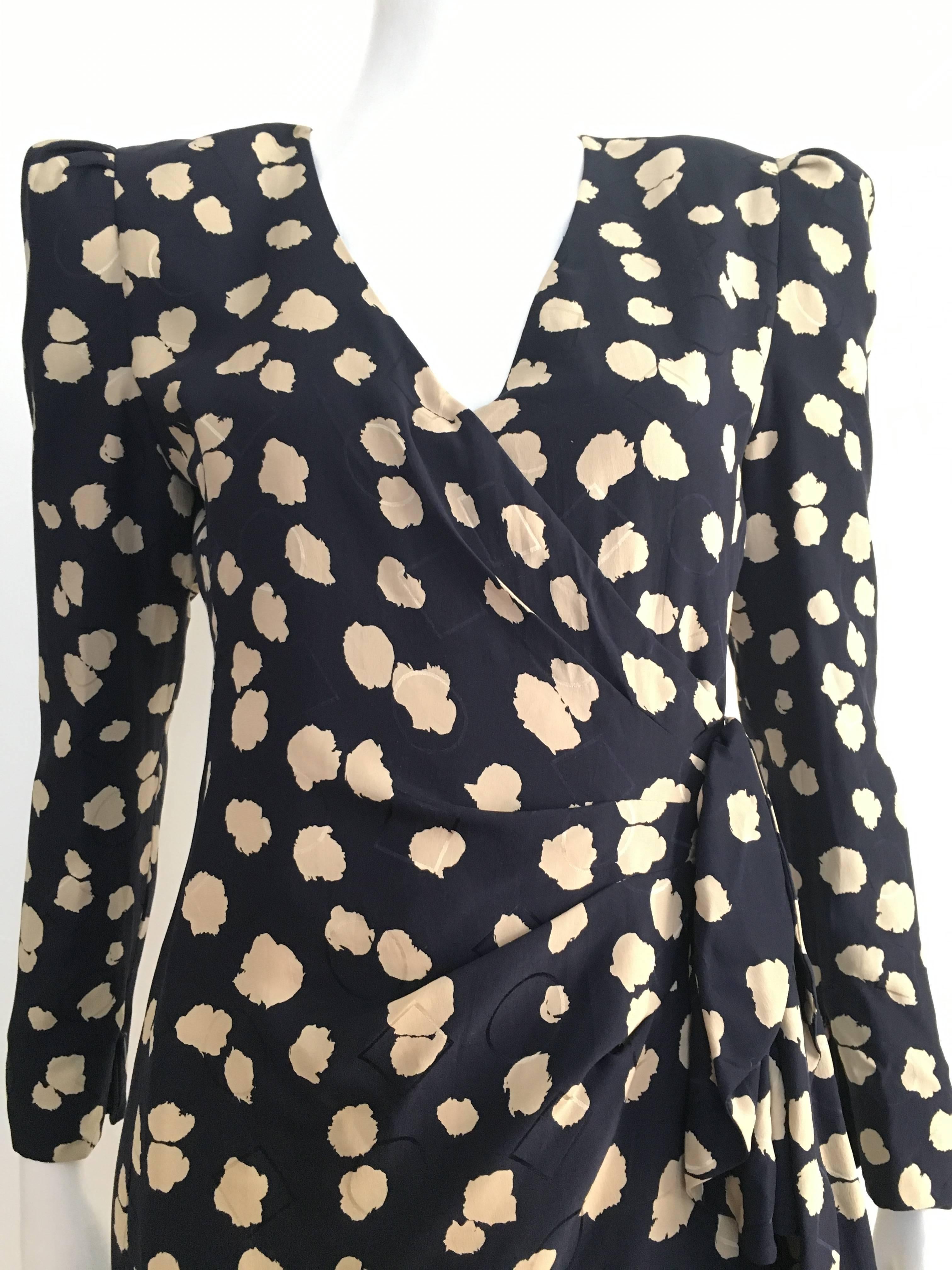 Carolina Herrera for Neiman Marcus 1990s navy silk cloud pattern faux wrap dress is a size 8.  Ladies please use your measuring tape so you can properly measure your bust, waist & hips to make certain this lovely vintage piece will fit you to
