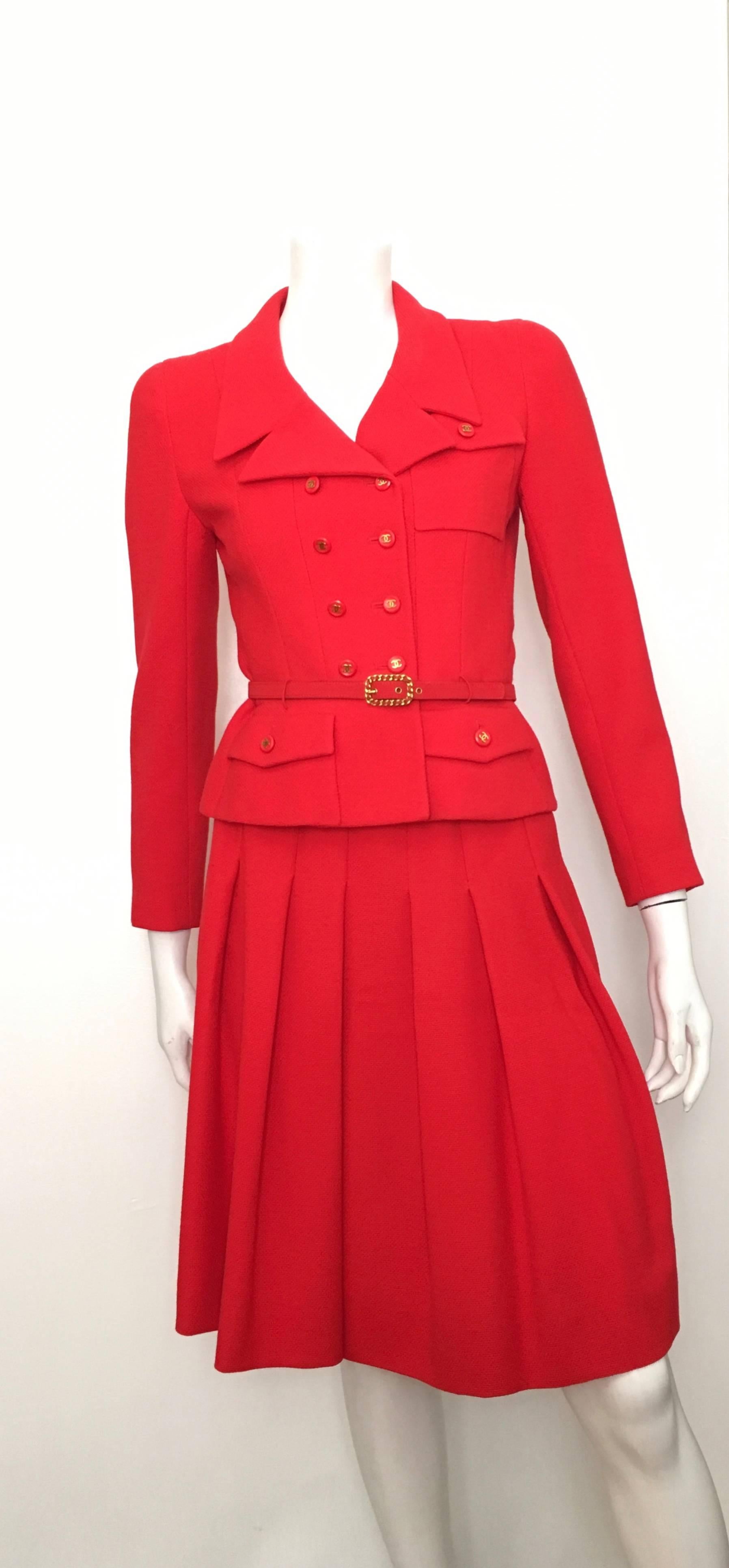 Chanel 1980s signature red powerhouse jacket & pleated suit is a French size 38 but fits like an USA size 4.  Ladies please use your measuring tape so you can properly measure your bust, waist & hips to make certain this will fit your lovely body