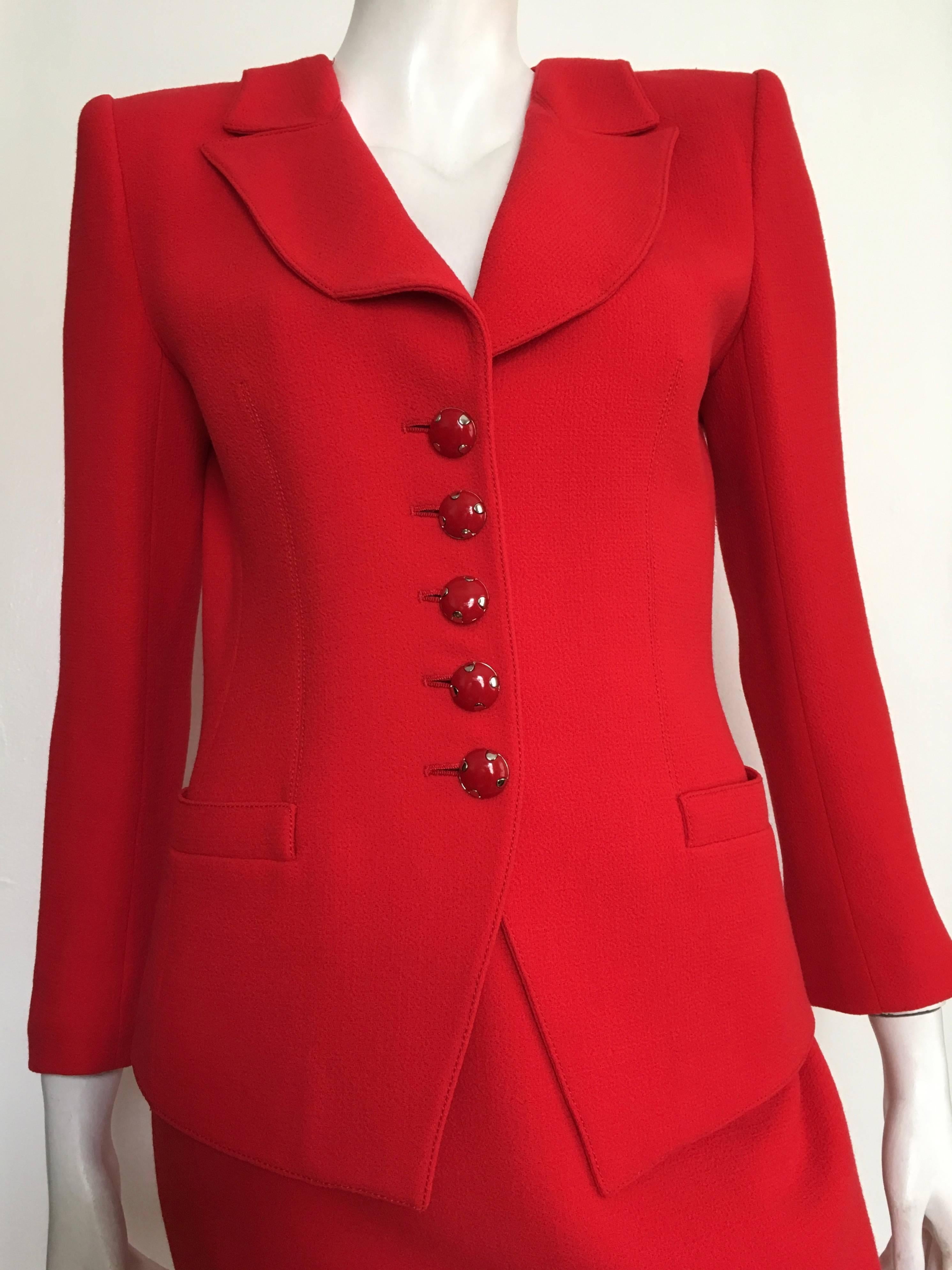 Emanuel Ungaro parallele Paris 1990s red power wool crepe suit is a size 6. Ladies please use your measuring tape so you can properly measure your bust, waist & hips to make certain this will fit the way Emanuel wanted it to on your lovely body. You