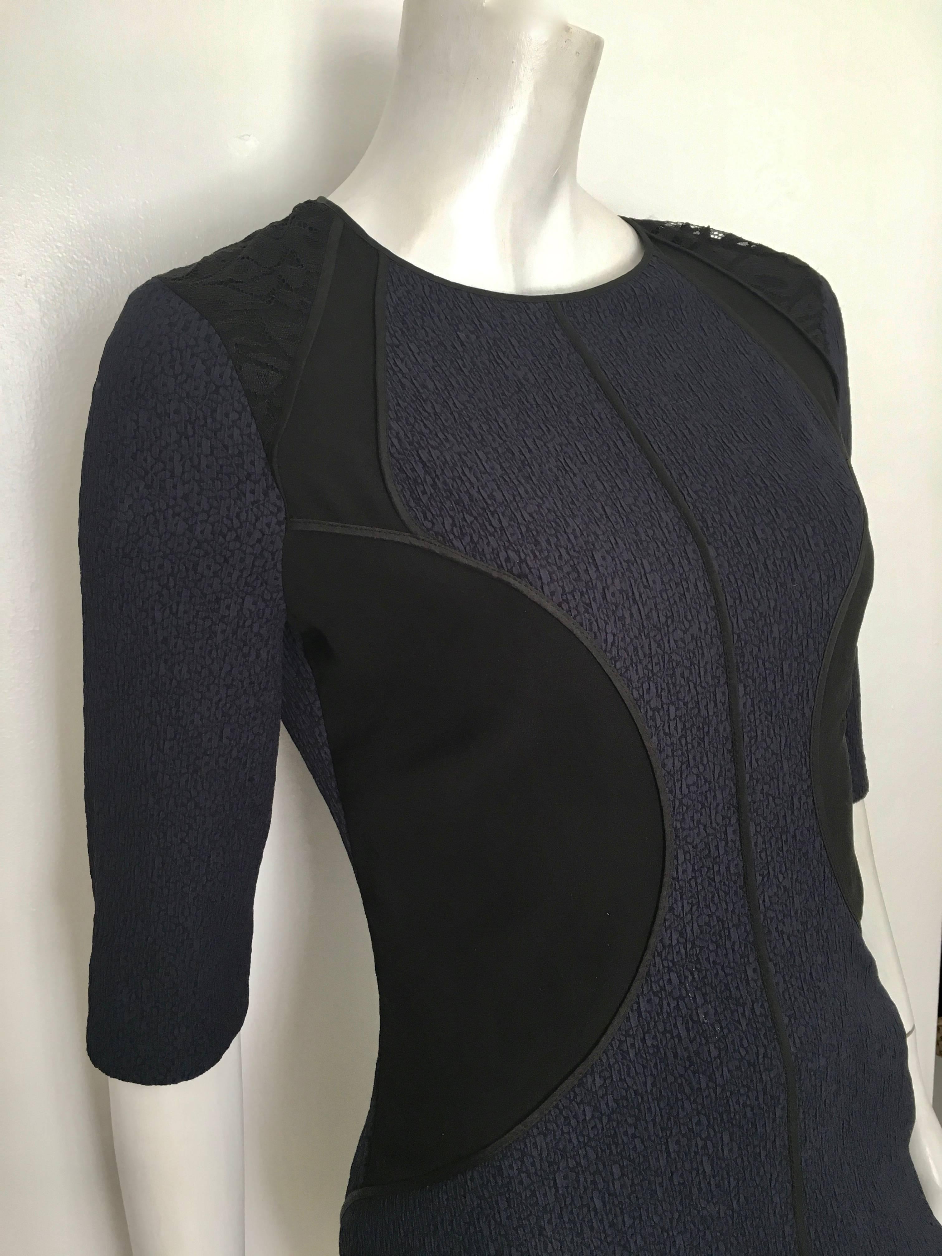 Nina Ricci silk navy & black lace trim is a French size 40 fits like an USA size 8.  Ladies please grab your measuring tape so you can properly measure your bust, waist & hips to make certain this will fit your body to perfection. This dress has