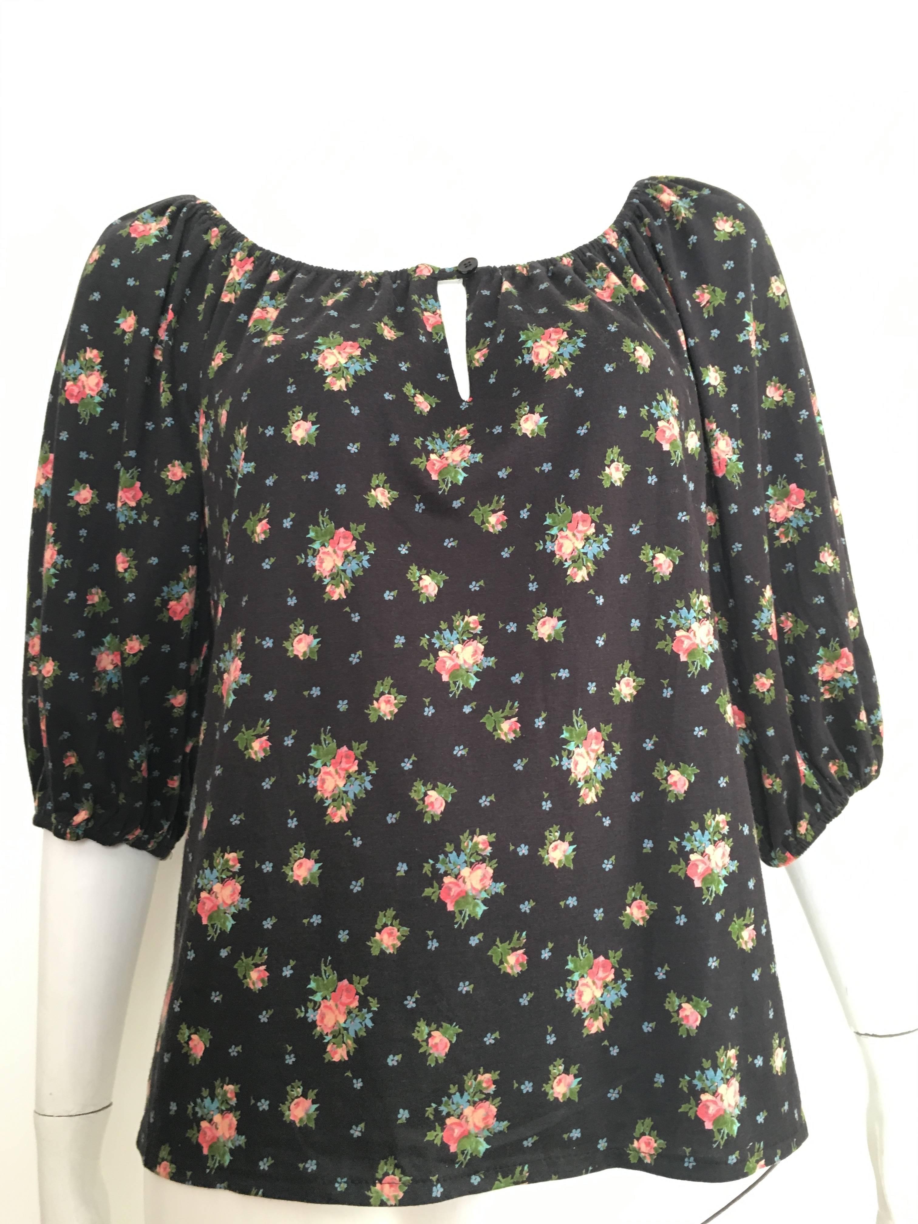 Oscar de la Renta Miss O 1970s label for Lord & Taylor department store floral pattern peasant blouse is a vintage size 14.  This blouse fits my size 4 mannequin perfectly and will also fit a size 6.  Ladies please grab your measuring tape so