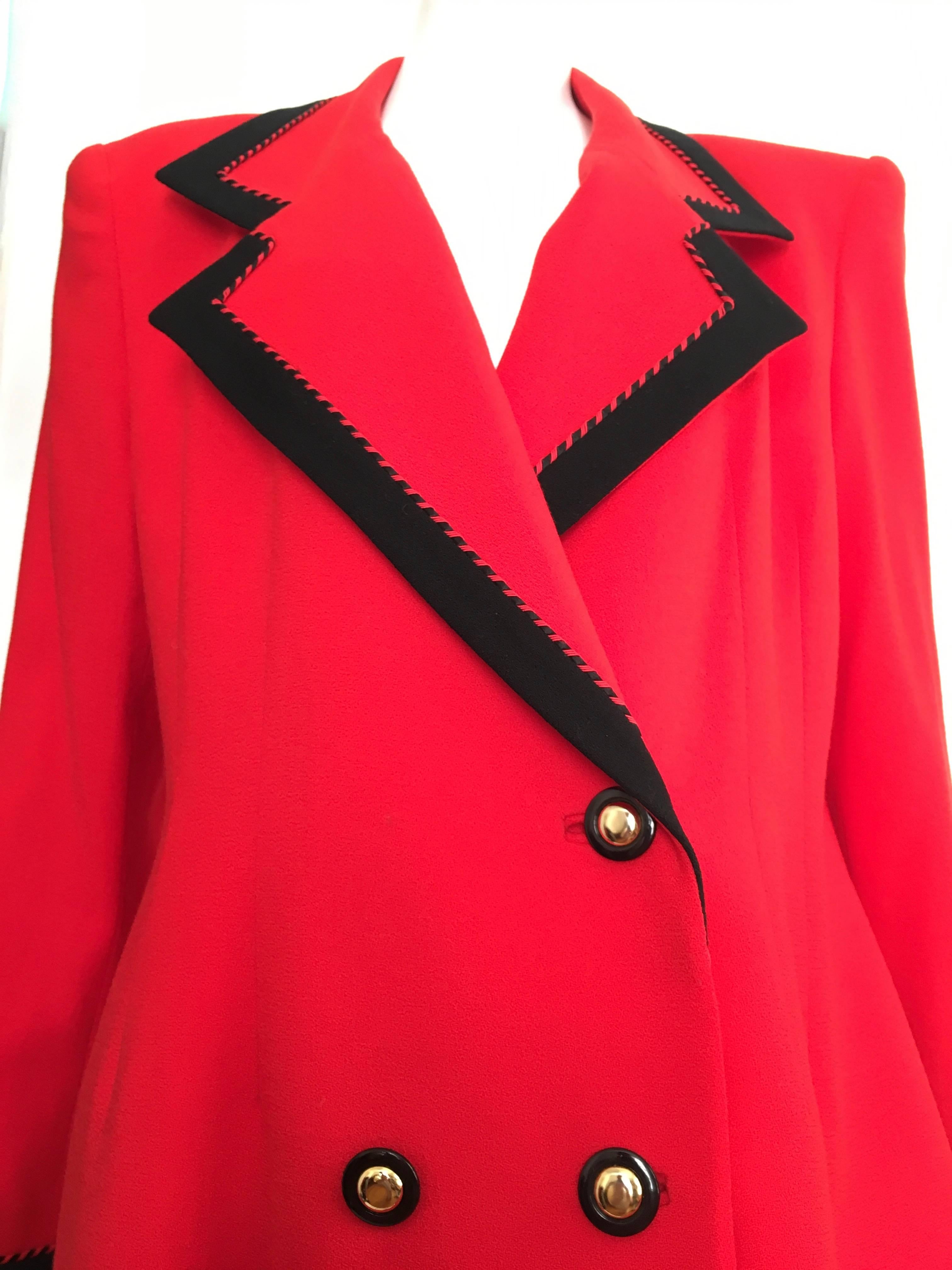 Lilli Ann 1980s bright red wool gold button up coat is a size large so this will fit a size 12 / 14.  The black trim makes this bright red coat pop. Exquisite quality and craftsmanship of this coat isn't seen on today's creations. Lilli Ann
