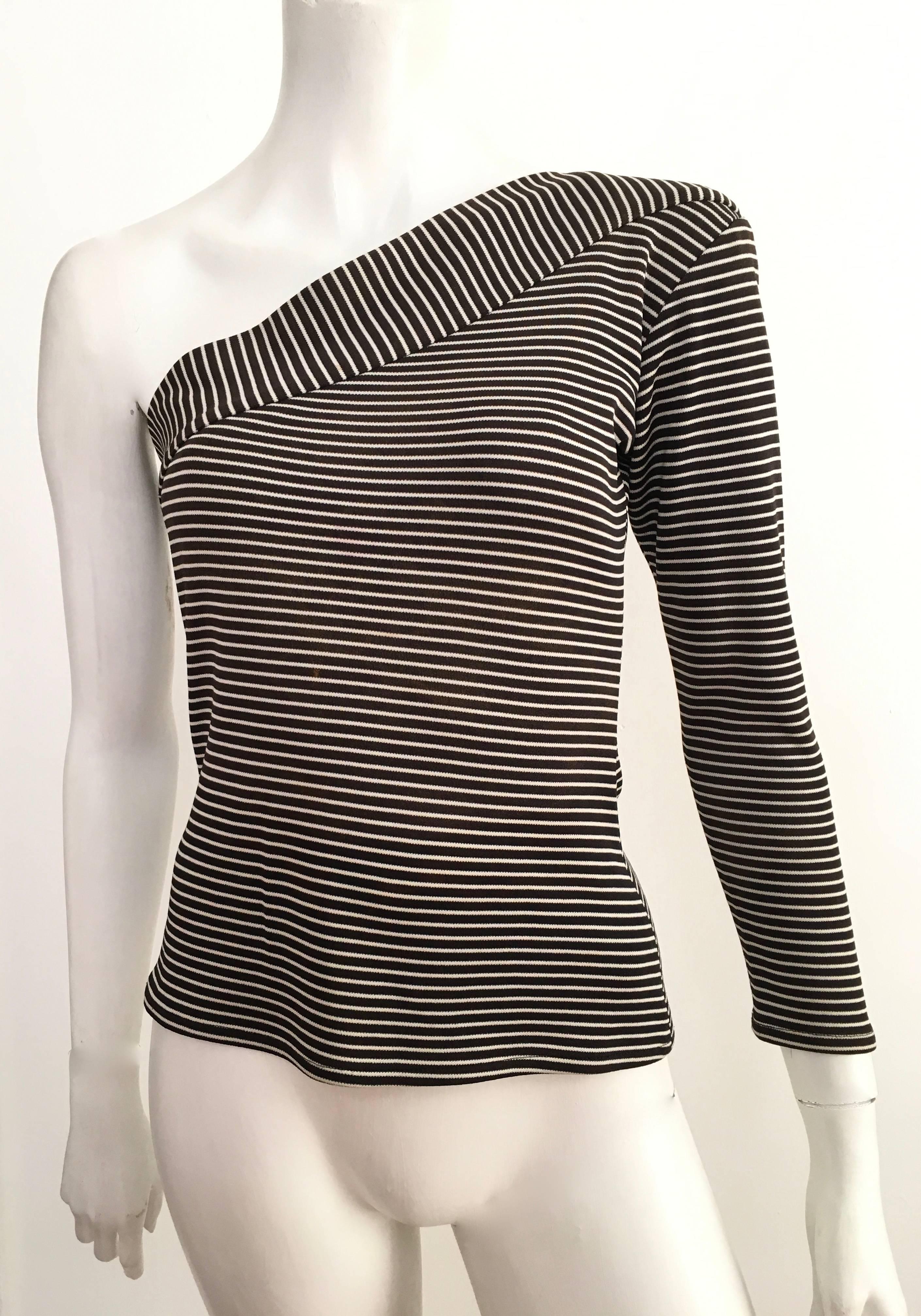 Saint Laurent by Yves Saint Laurent 1980s black & white striped knit one should long sleeve top is a size 4.  Ladies please grab your trusted tape measure so you can properly measure your bust line and sleeves to make certain this will fit your