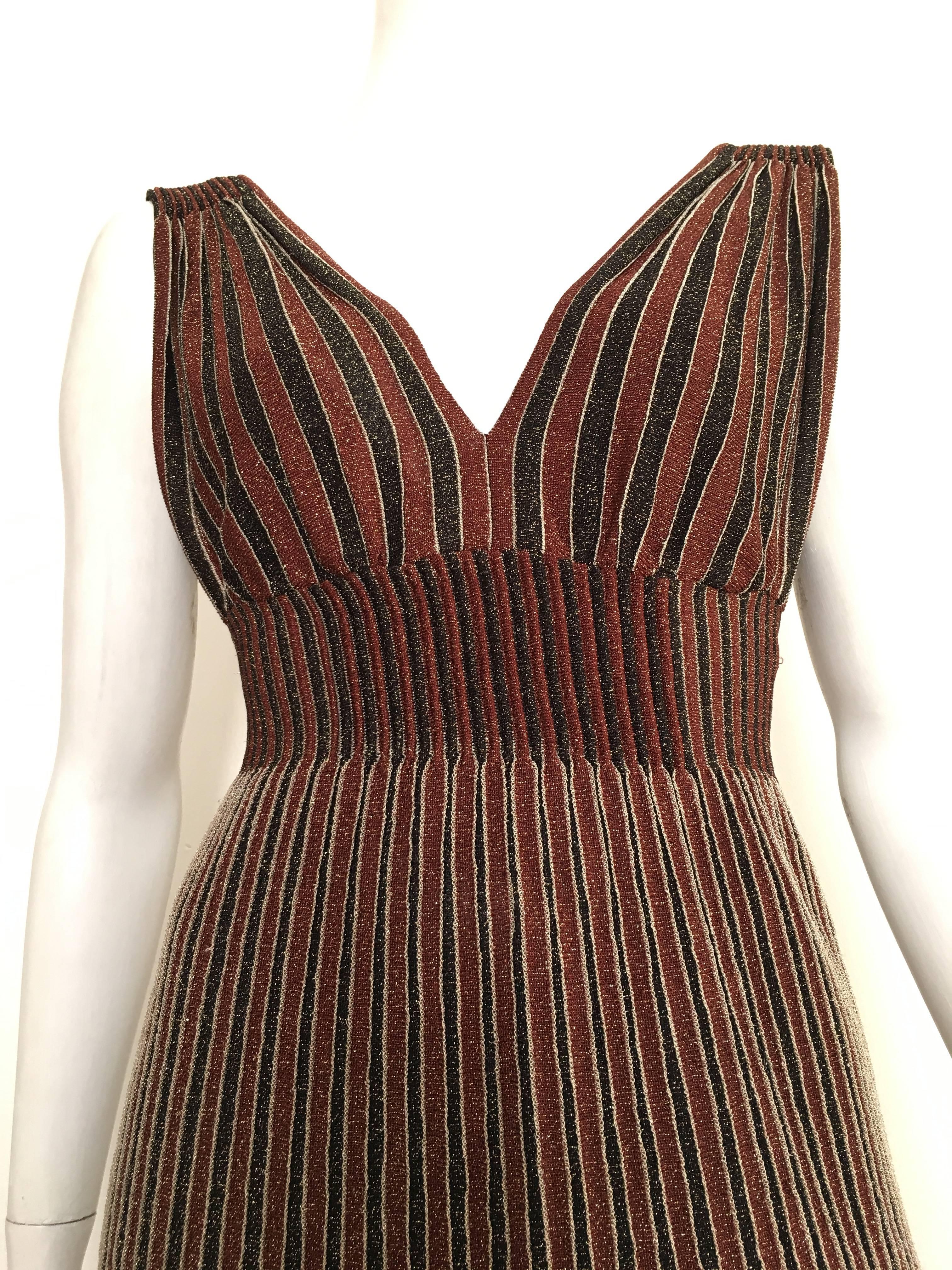 Missoni brown & black striped with gold metallic threading is an USA size 4/6.  Ladies please grab your tape measure so you can properly measure your bust, waist & hips to make certain this will fit your lovely body. Dress has a built in slip for