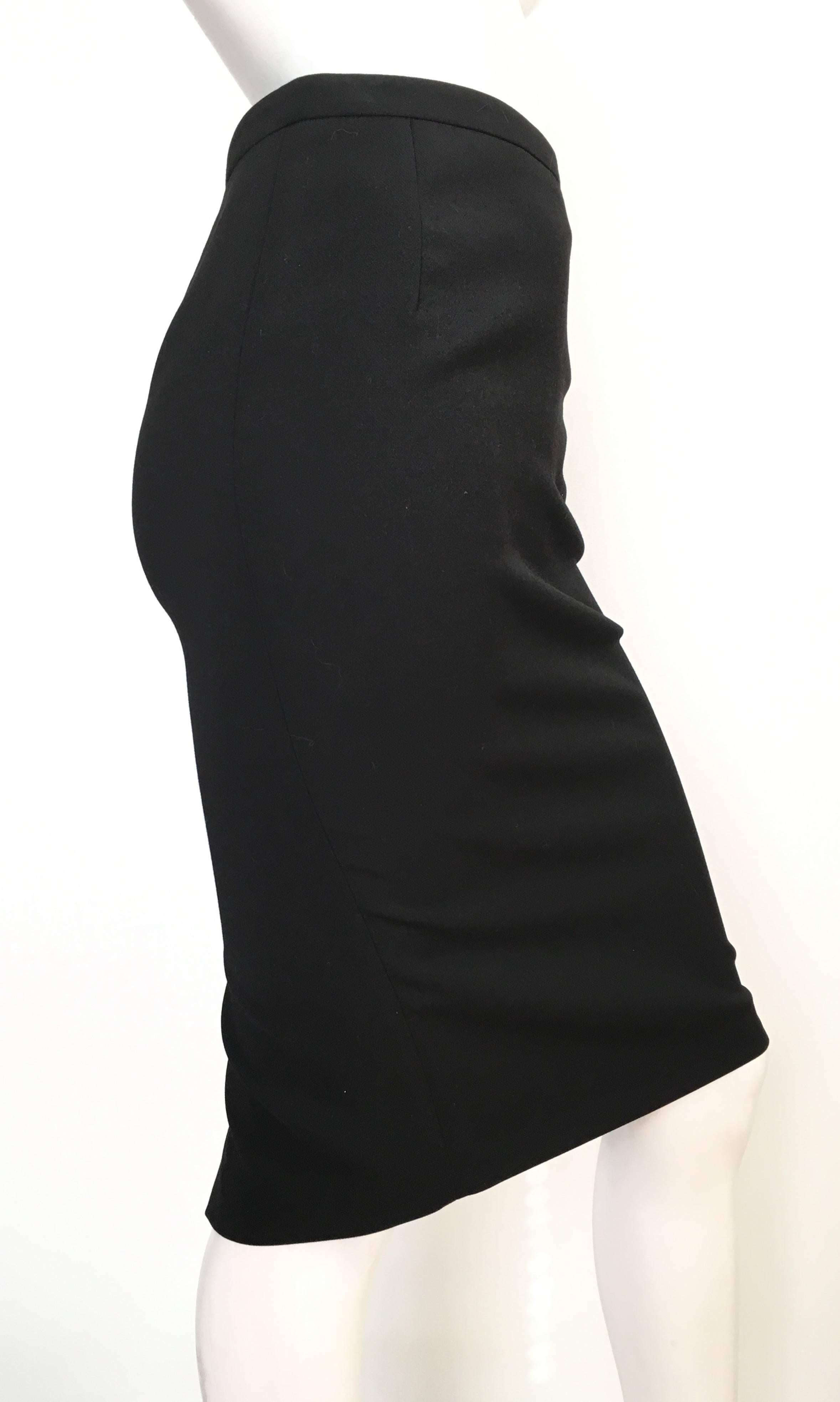 Gucci 2013 black wool pencil skirt is an USA size 4 and an Italian size 38.  Ladies please grab your trusted tape measure so you can measure your waist & hips to make certain this sexy Gucci skirt will fit you to perfection. The skirt is made