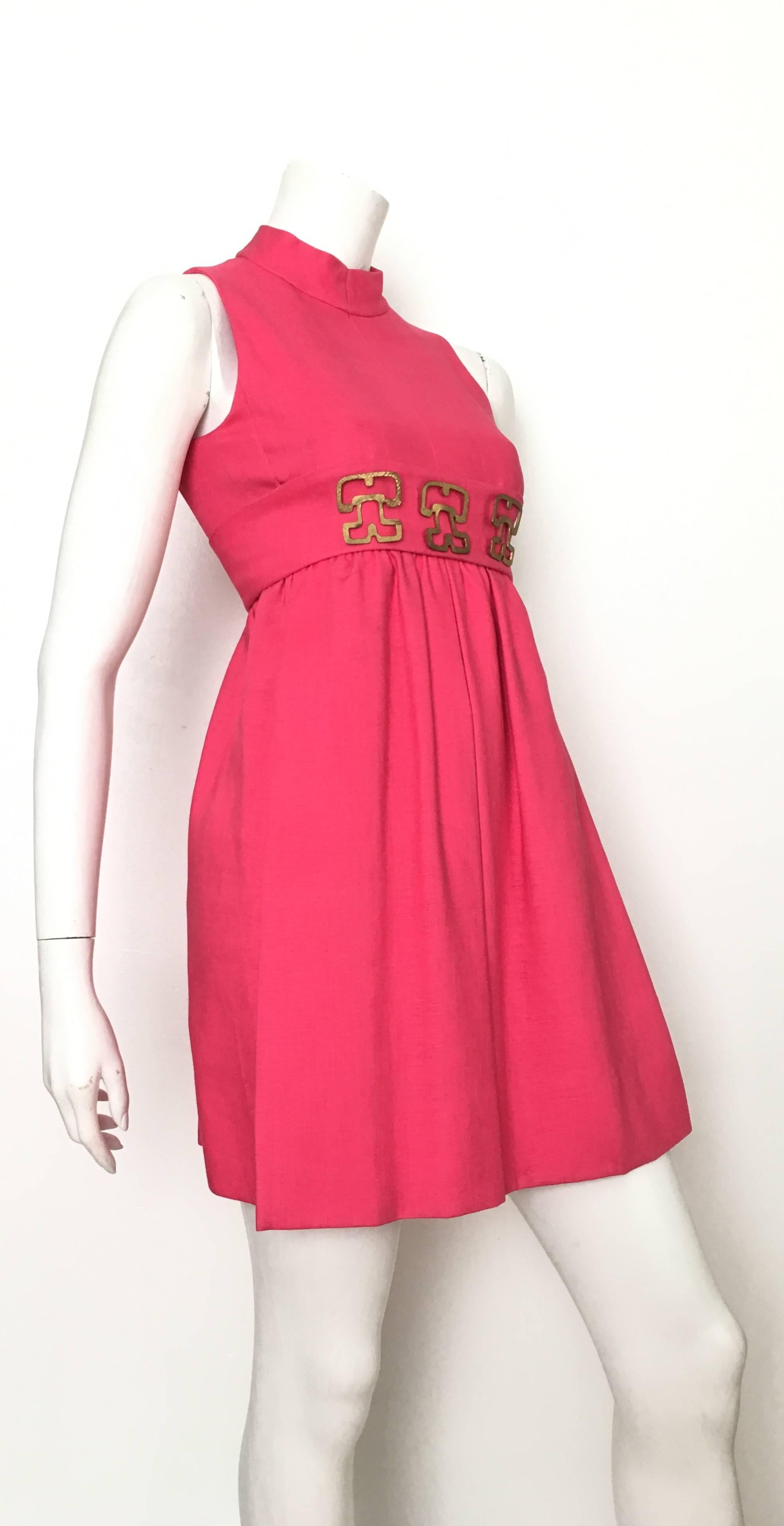 Donald Brooks 1970s pink linen sleeveless cocktail dress is a size 4.  Ladies please grab your tape measure so you can properly measure your bust, waist & hips to make certain this vintage treasure will fit your lovely body.  Three abstract metal