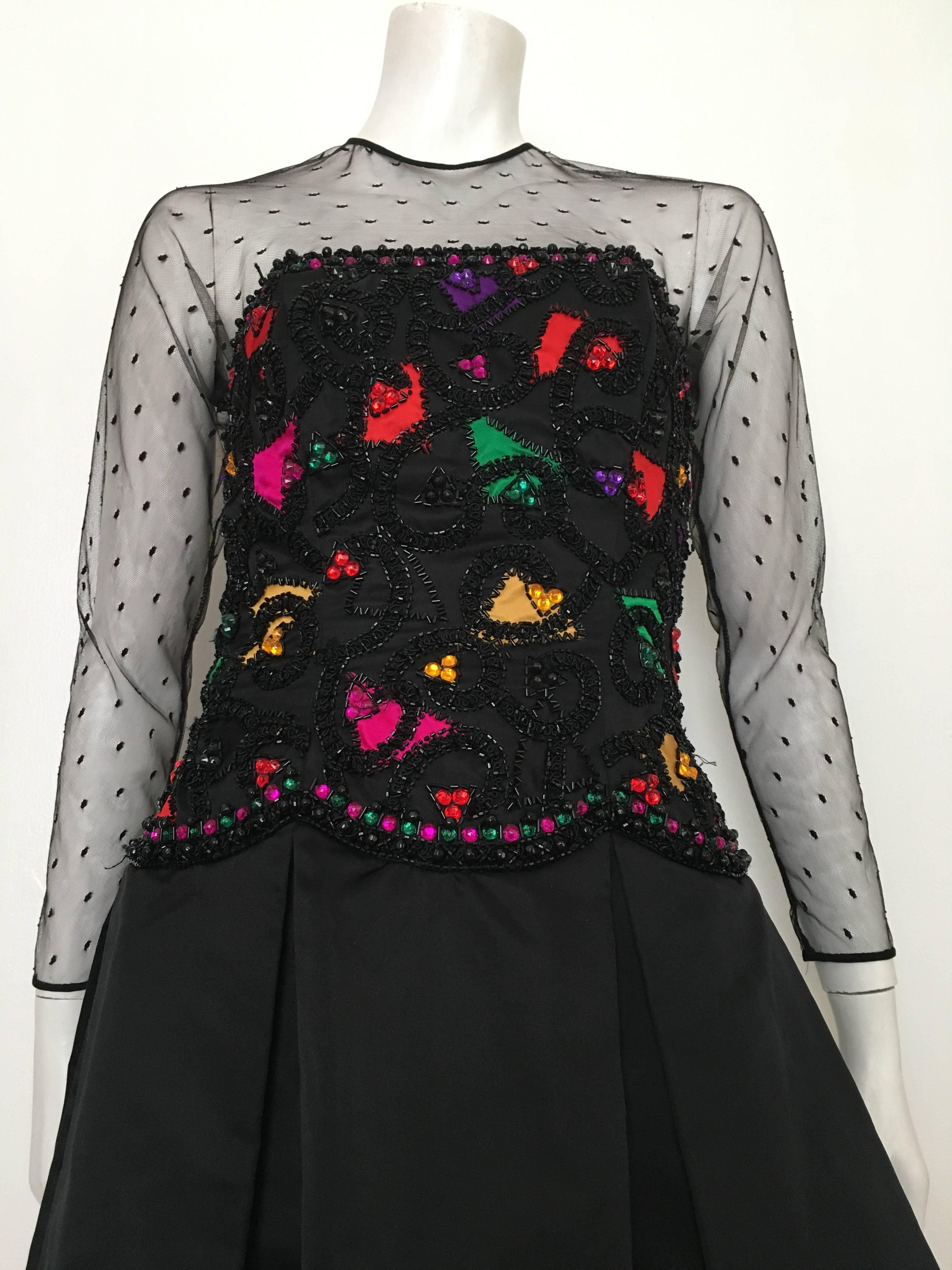 Victoria Royal 1980s black beads & rhinestone bodice with netting collar & sleeves is a size 6.  Ladies please grab your trusted tape measure so you can properly measure your bust, waist & hips to make certain this absolutely stunning dress will fit