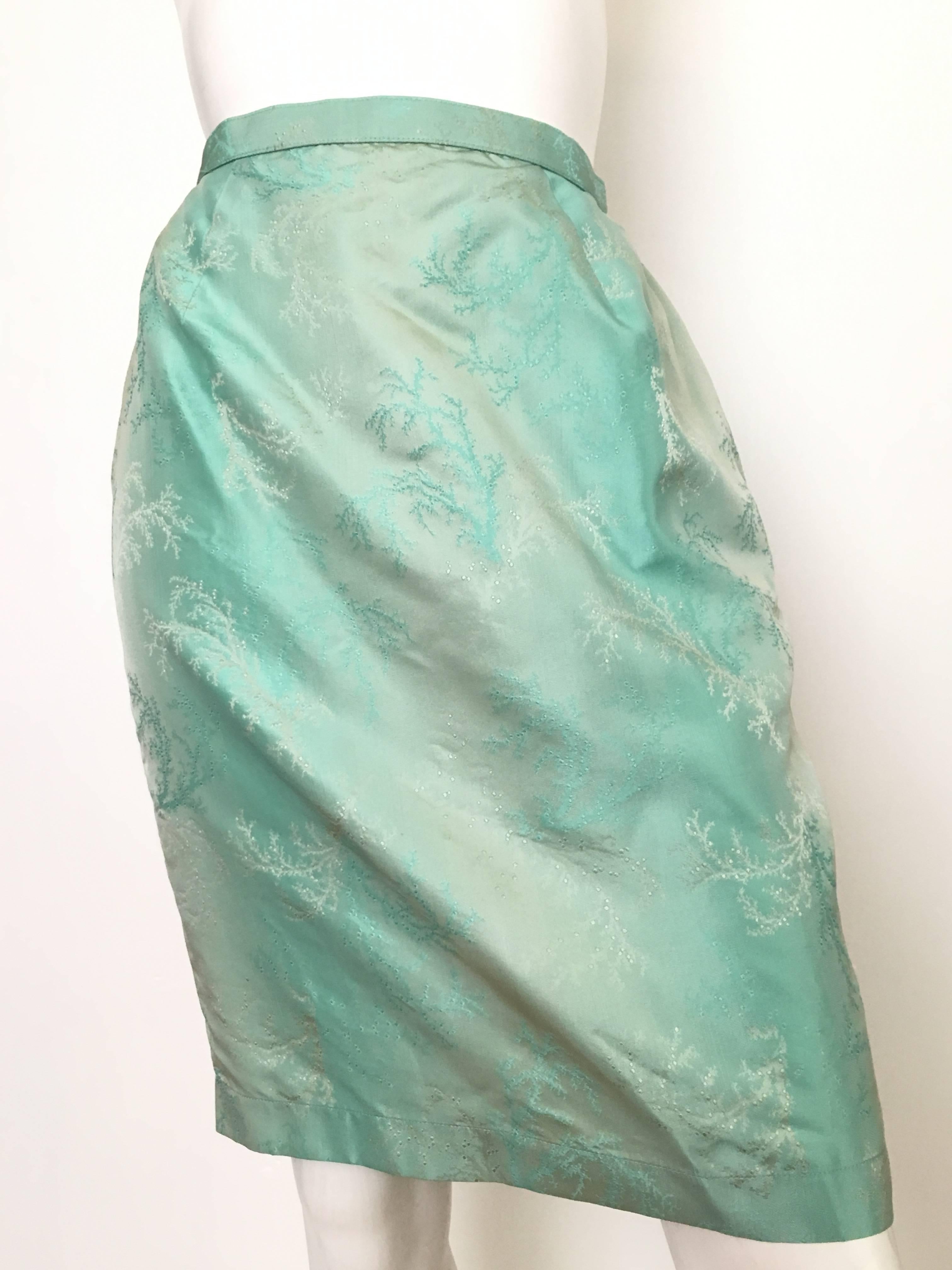 Thierry Mugler 1980s iridescent aqua sexy skirt is a French size 40 and fits like an USA size 4/6.  Ladies please grab your trusted tape measure so you can properly measure your waist & hips to make certain this vintage treasure will fit you to