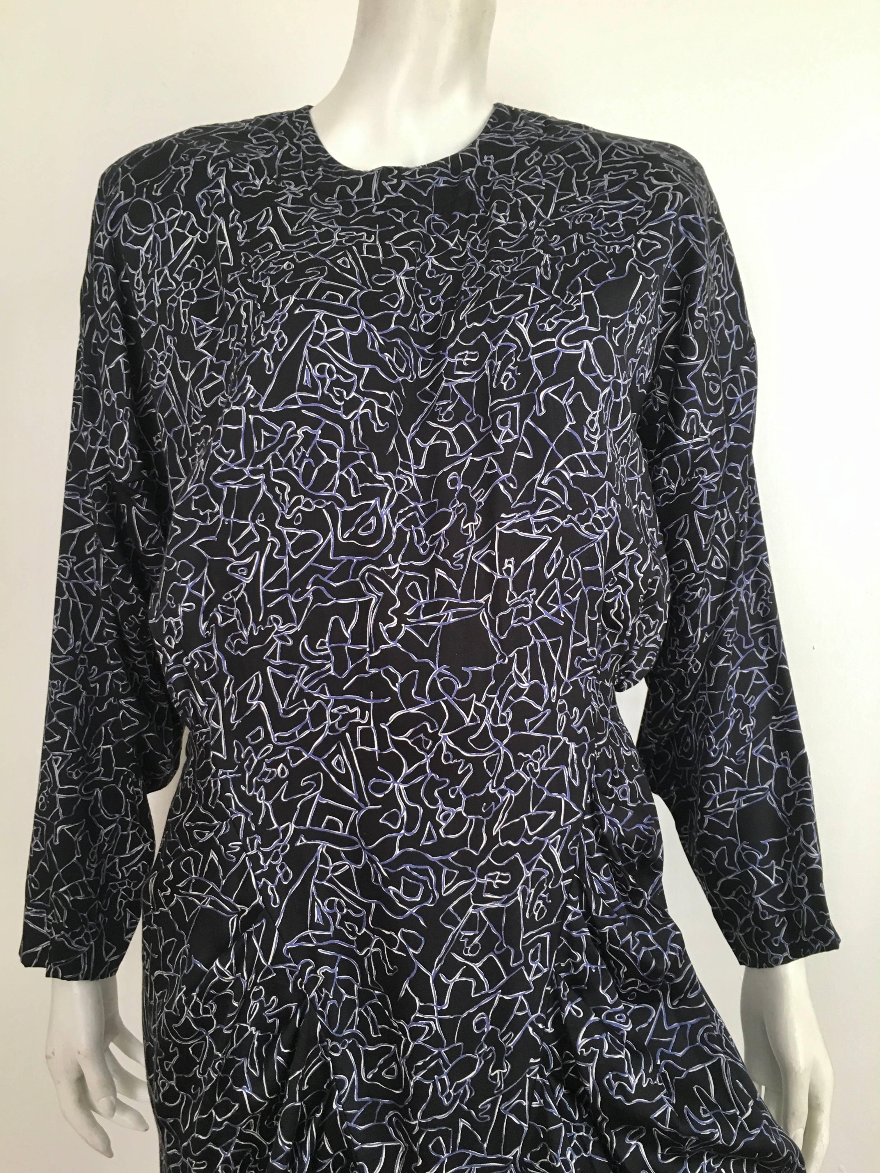 Nicole Miller 1980s black cotton abstract print aesthetic design dress is labeled a size 12 but fits like a modern USA size 10.  Ladies please grab your trusted tape measure so you can properly measure your bust, waist & hips to make certain