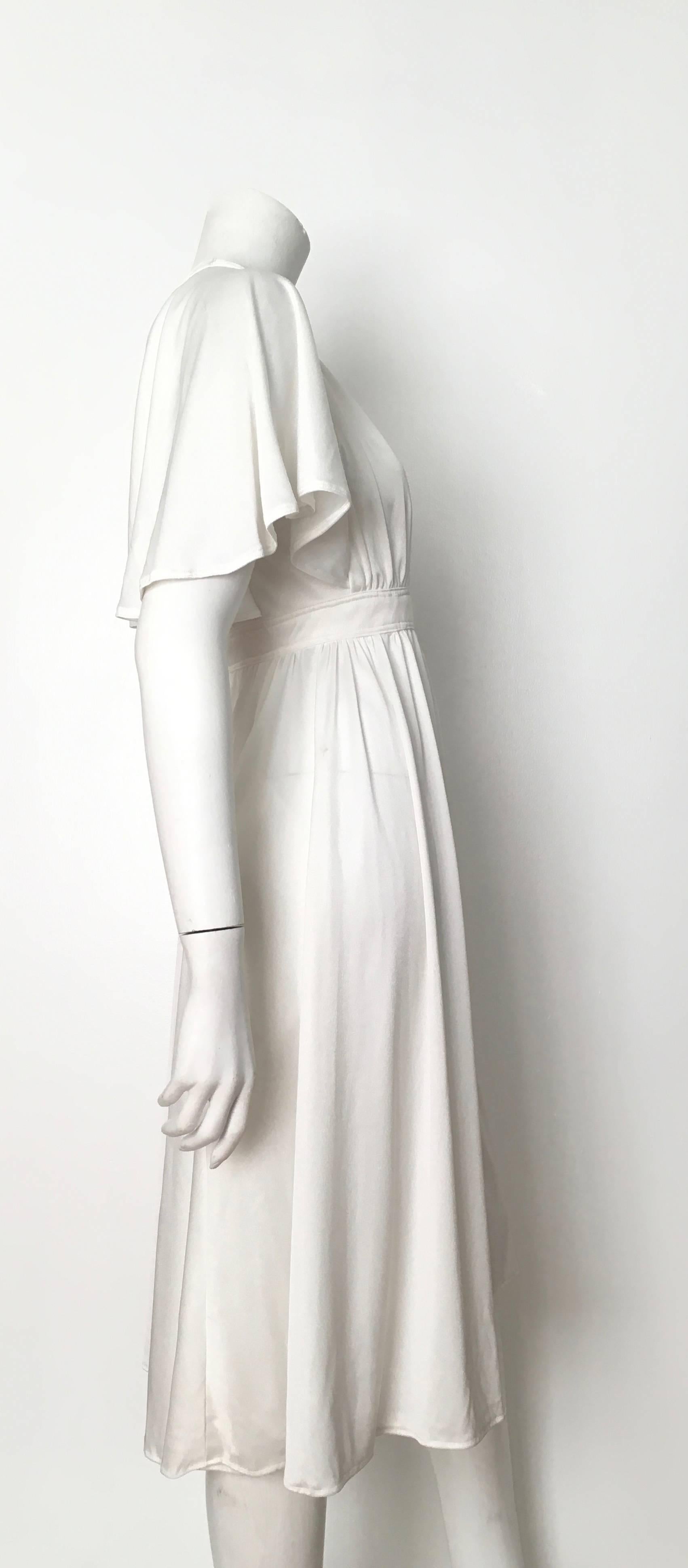 Women's or Men's Pierre Cardin 1970s White Jersey Dress with Pockets Size 4. For Sale