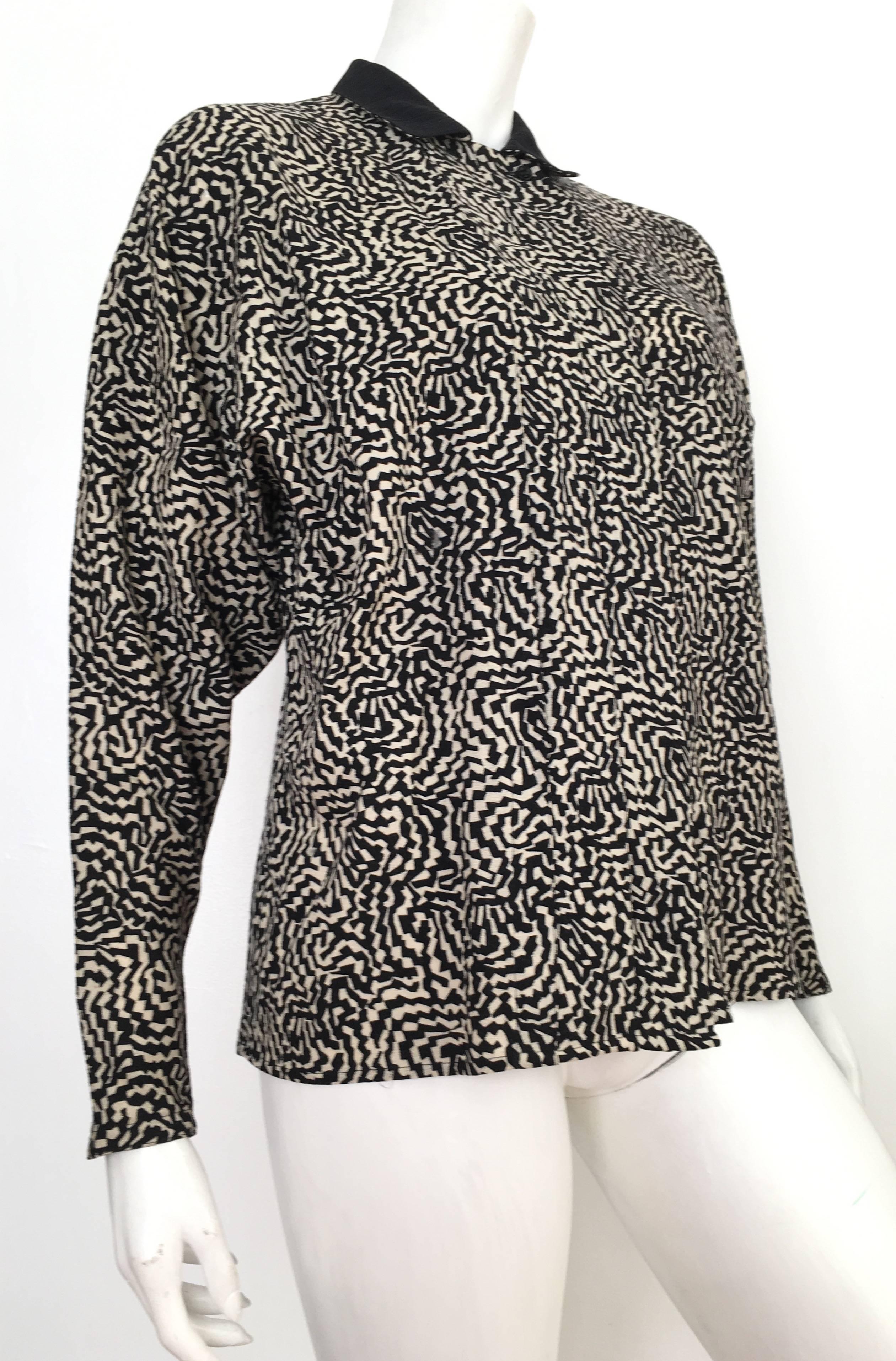 Gianni Versace 1980s wool gorgeous abstract pattern button up blouse with dolman zipper sleeves is a size 6.  Ladies please grab your trusted friend, Mr. Tape Measure, so you can properly measure your bust & arm length to make certain this vintage