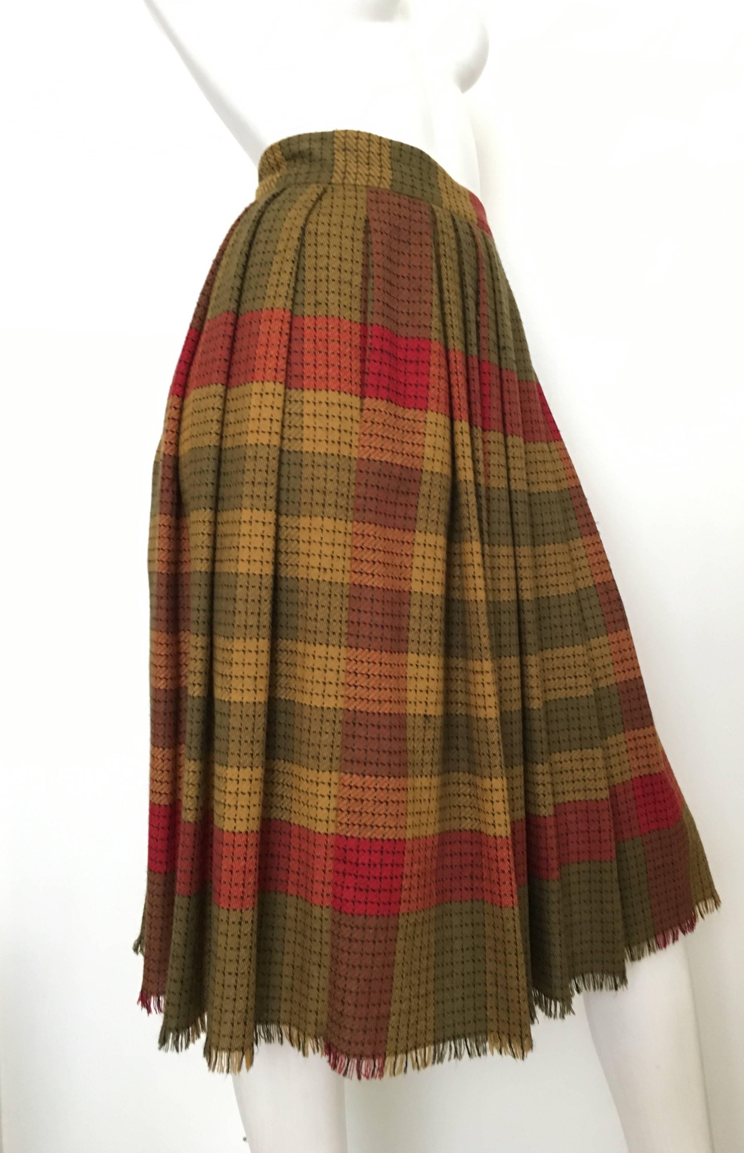 Emanuel Ungaro Parallele Paris 1980s wool plaid button up pleated skirt with single pocket is a size 4.  Ladies please grab your tape measure so you can properly measure your waistline & hips to make certain this treasure will fit your lovely