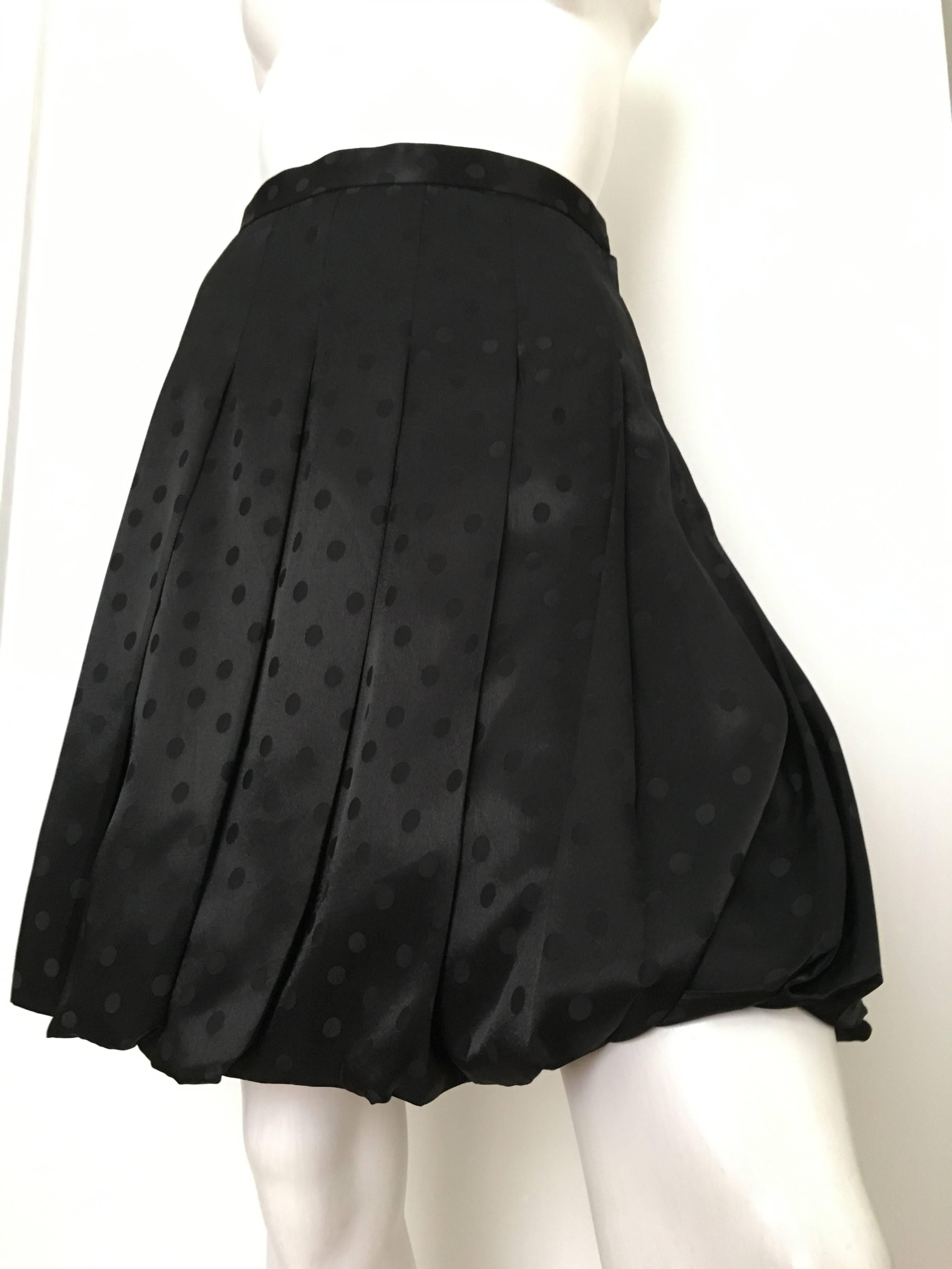 Comme des Garçons by Junya Watanabe black jacquard polka dot pleated bubble skirt is a size small and fits like an USA size 6.  Ladies please grab your tape measure so you can properly measure your waist & hips to make certain this piece will fit