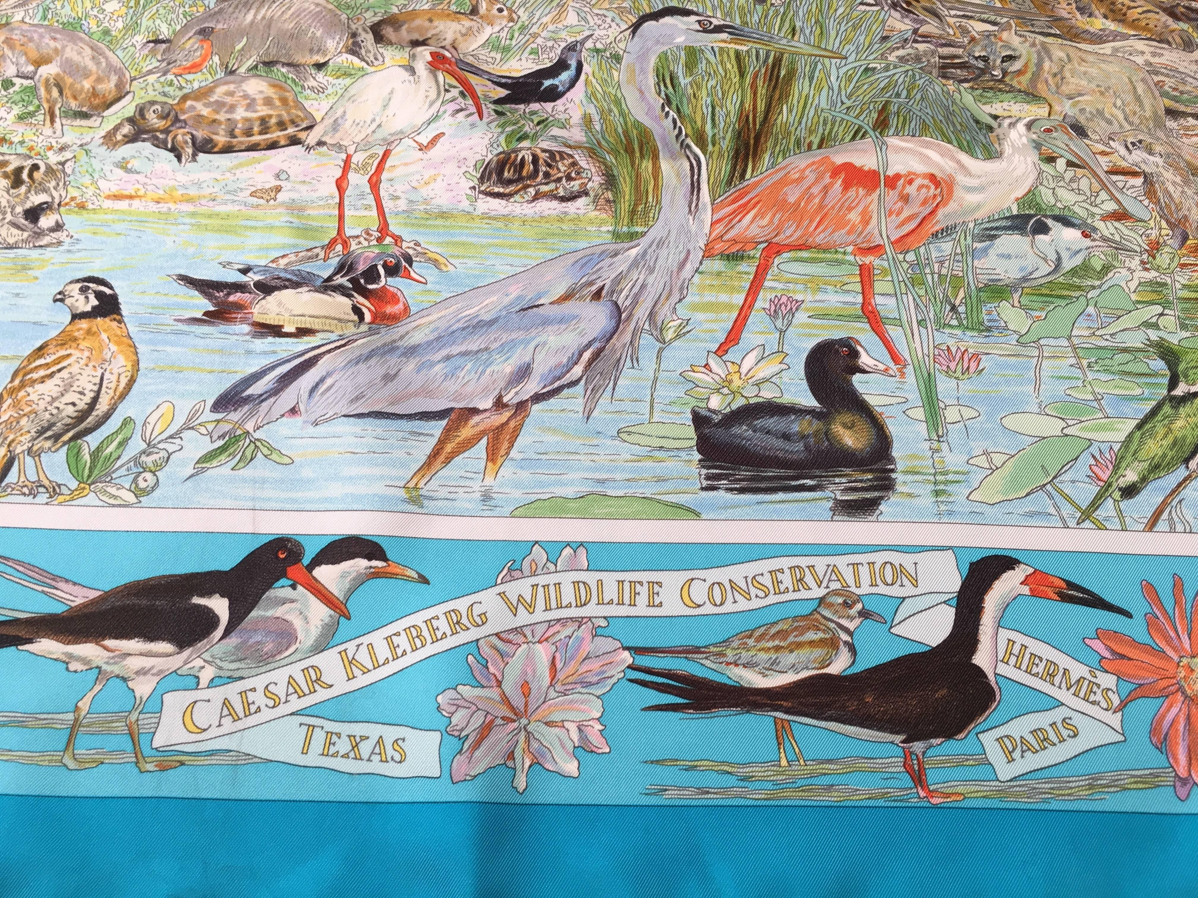 Hermes by Kermit Oliver Caesar Kleberg Wildlife Conservation blue / turquoise silk scarf.  Authentic limited edition Hermes 35" by 34" twill silk scarf for Caesar Kleberg Wildlife Conservation Texas, an amazing design by American artist