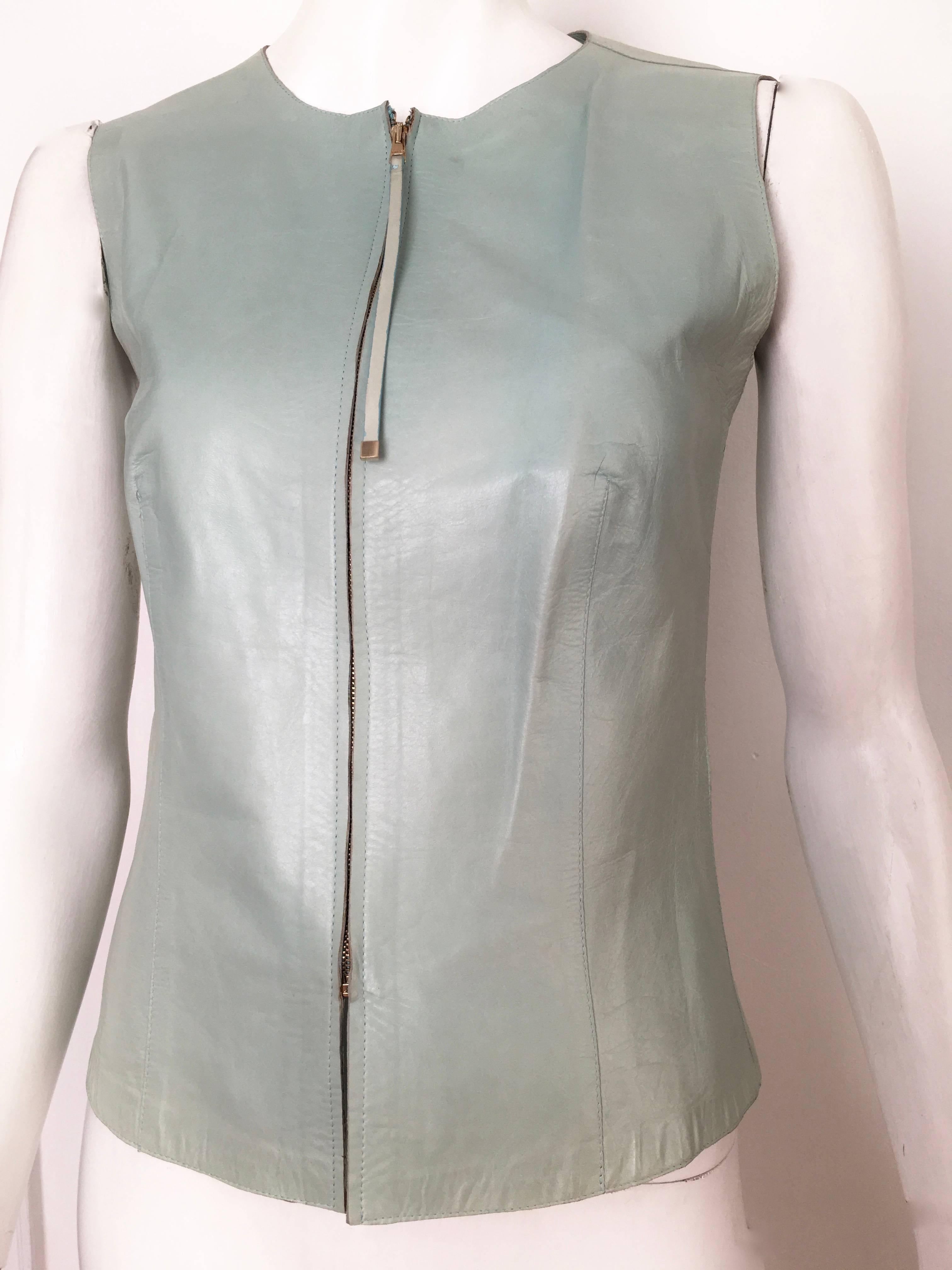 Gucci by Tom Ford late 1990s leather aqua zipper vest is an Italian size 40 or an USA size 4.  This vest was purchased by my client at Neiman Marcus and never worn, it settled into the back of her closet for years. Ladies please grab your trust