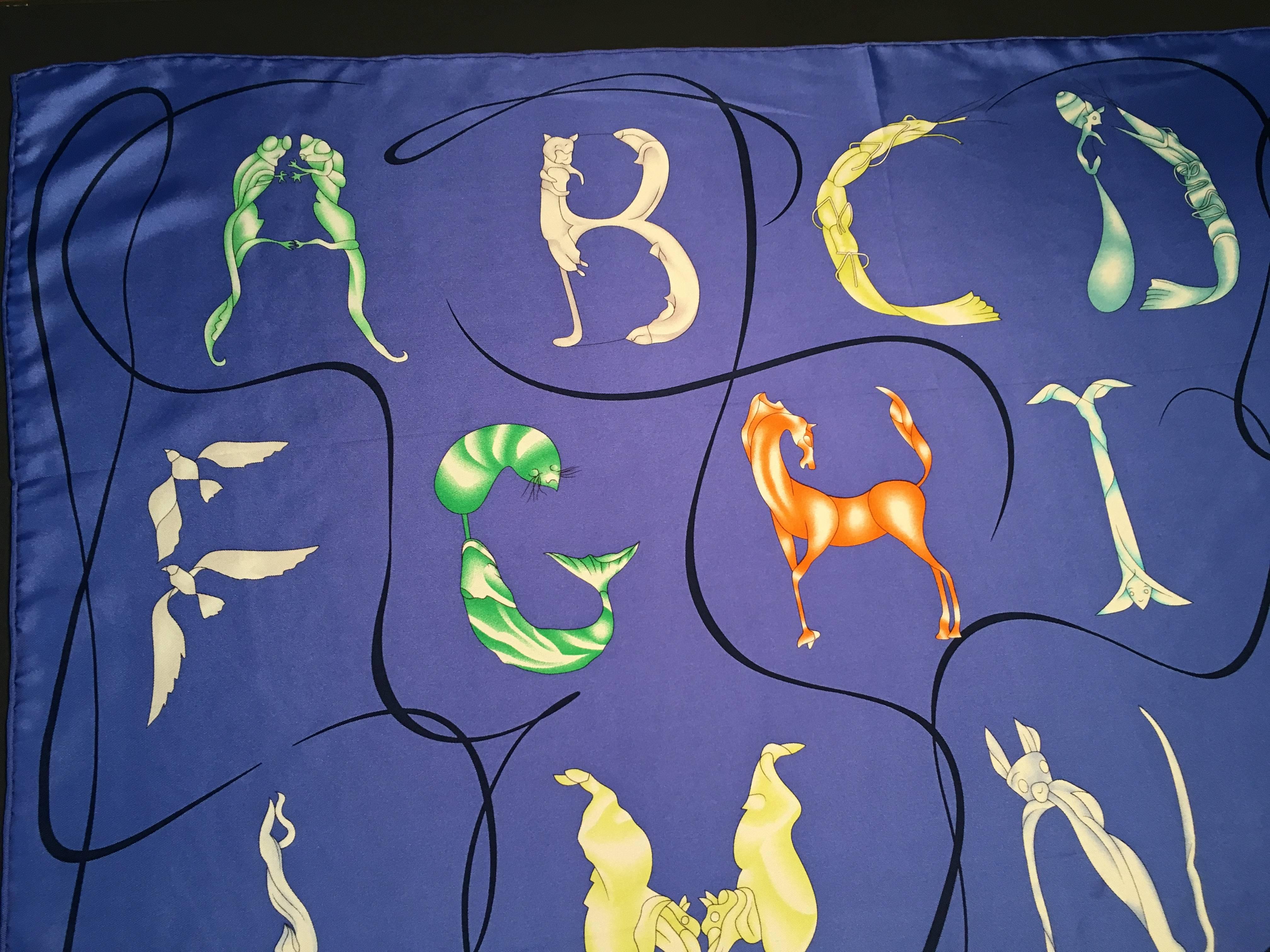 Hermes alphabet silk scarf by Florence Manlik 35" x 35" 89cm x 89cm. The subject is a firm favourite with the Hermès designers, the creators of a host of imaginative alphabets over the years. Florence Manlik presents her own interpretation