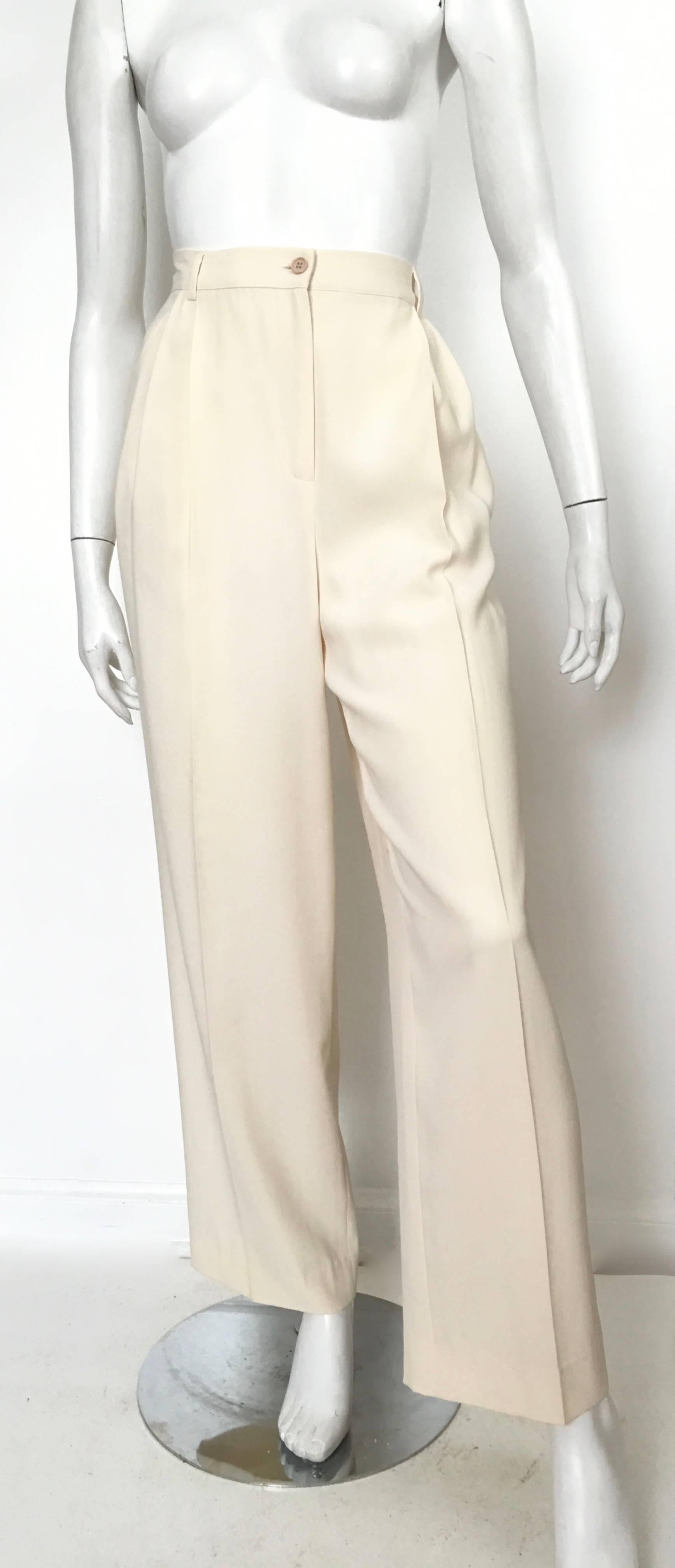 Valentino Miss V 1990s classic cream color pleated pants with pockets is labeled a size 12 but fits like a modern USA size 8.  Ladies please grab your trusted friend, Mr. Tape Measure, so you can measure your waist, hips & inseam to make certain