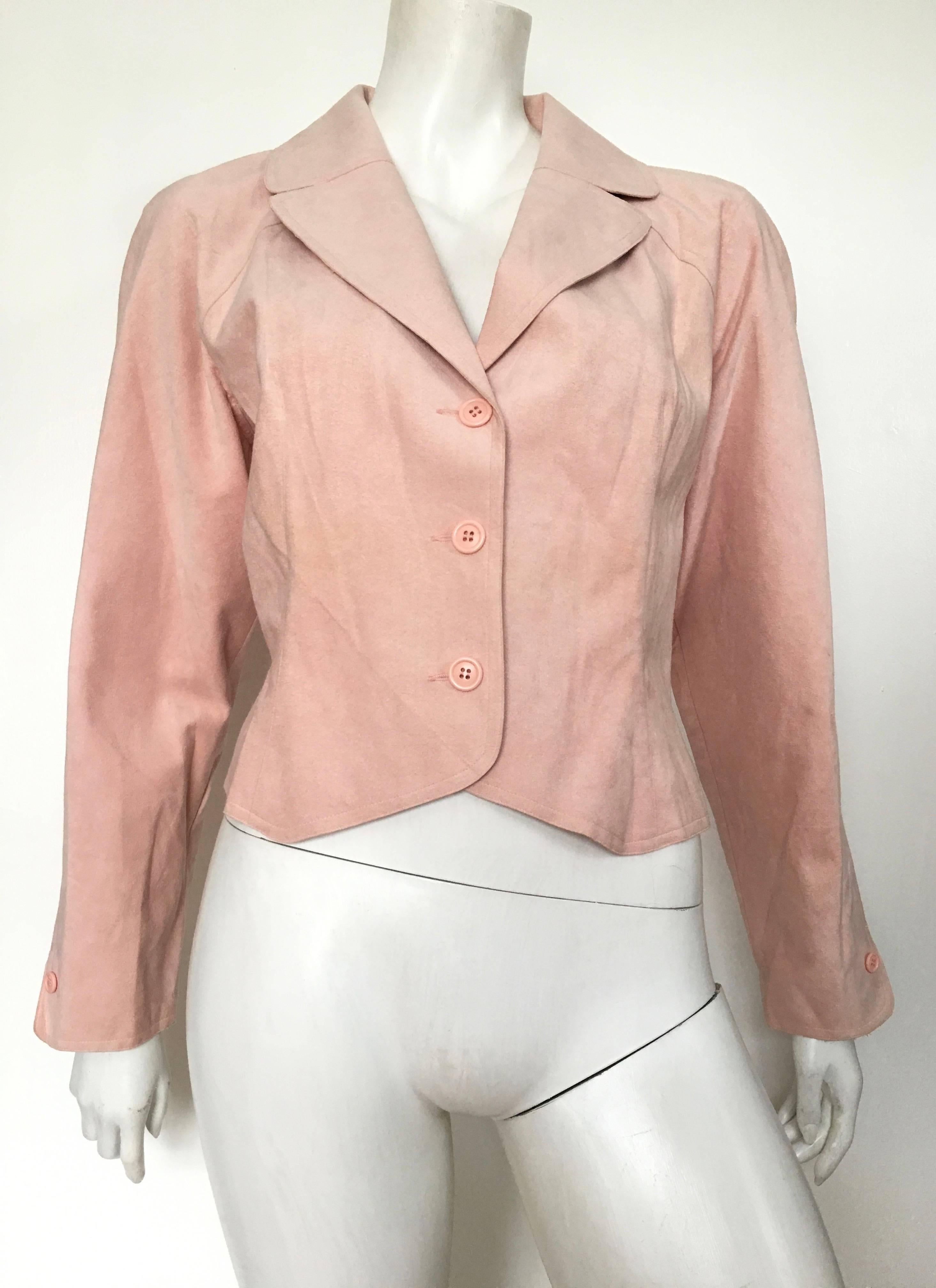 HALSTON 1970s pink ultra suede cropped jacket is a size 14.  Ladies please grab your tape measure so you can properly measure your bust, waist & arms to make sure this vintage treasure will fit you to perfection. This gorgeous cropped jacket,