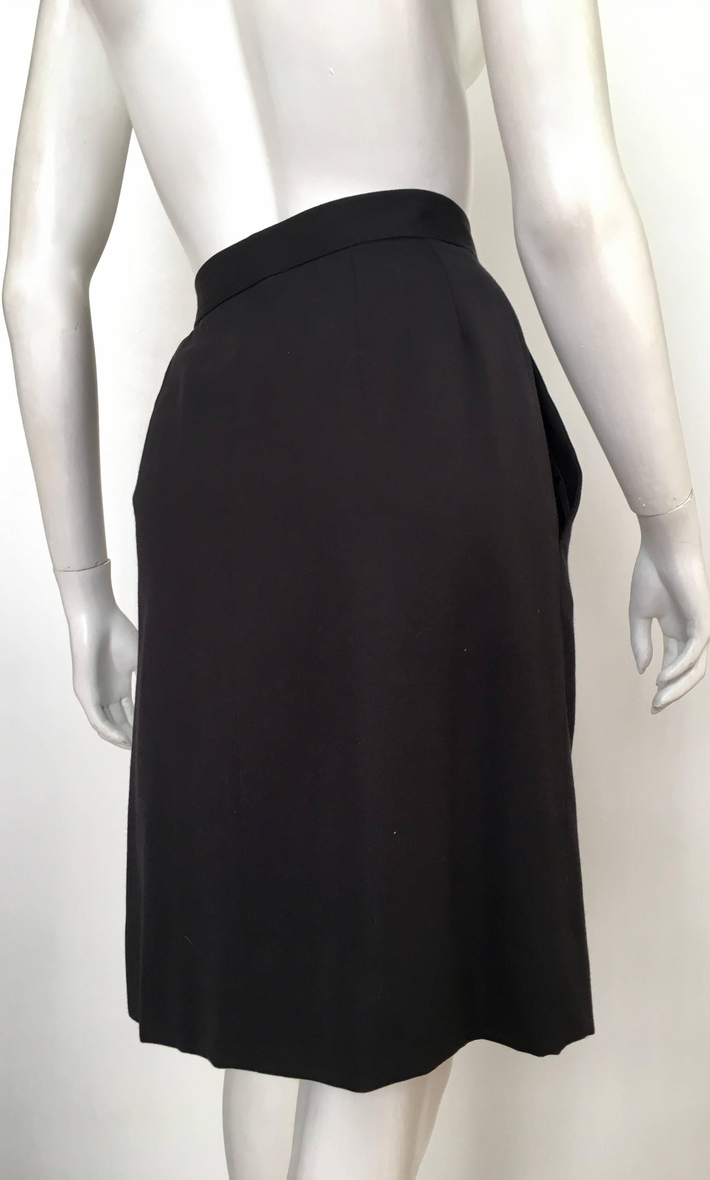 Yves Saint Laurent 1990s Black Wool Wrap Skirt with Pockets Size 6 / 8. In Excellent Condition For Sale In Atlanta, GA