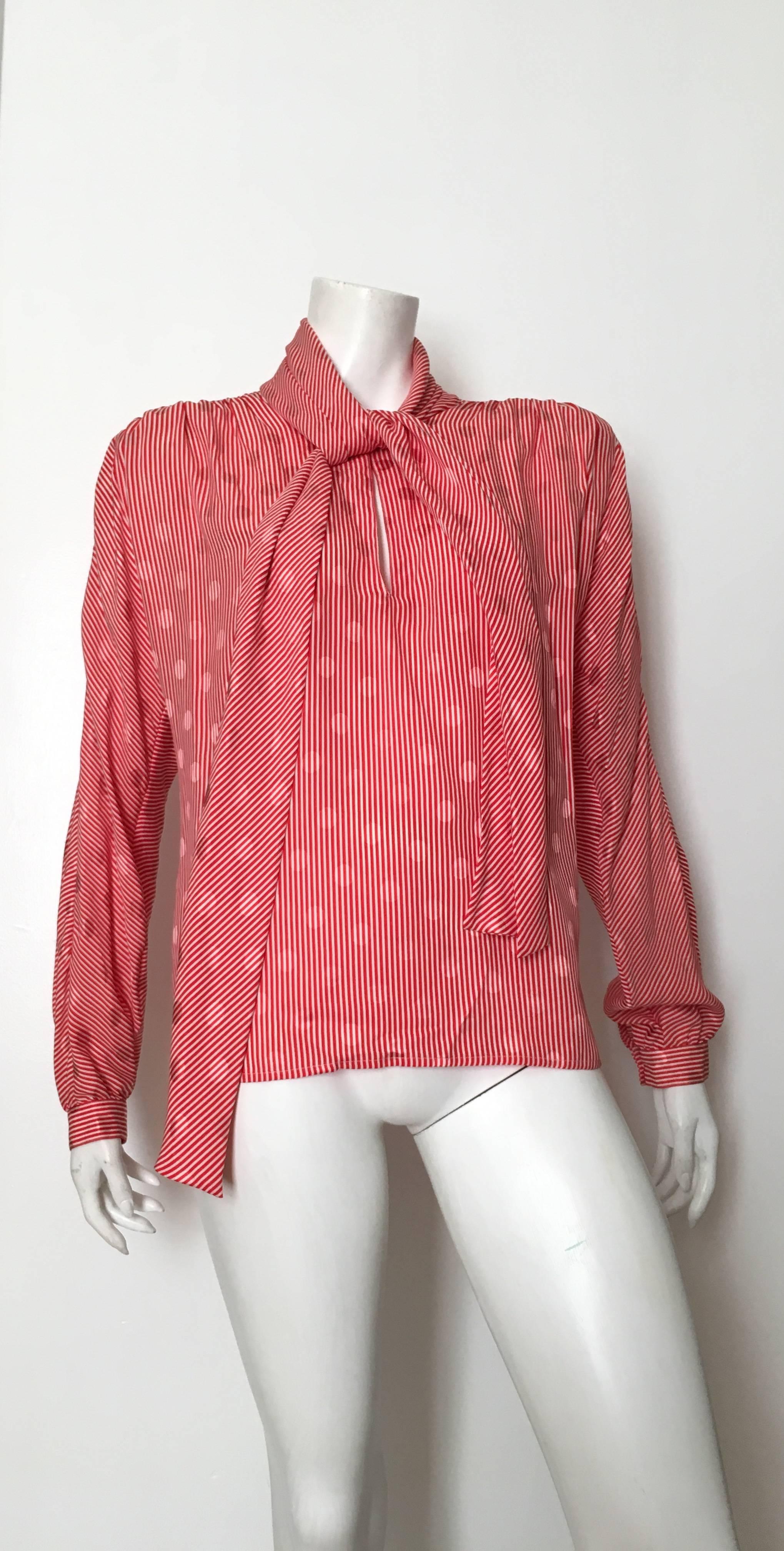 Valentino 1980s silk red & white striped with jacquard polka dot print blouse is an Italian size 44 and fits like an USA size 8. This blouse was purchased and never worn by my client. It still has the original tag from Rich's Department store. There